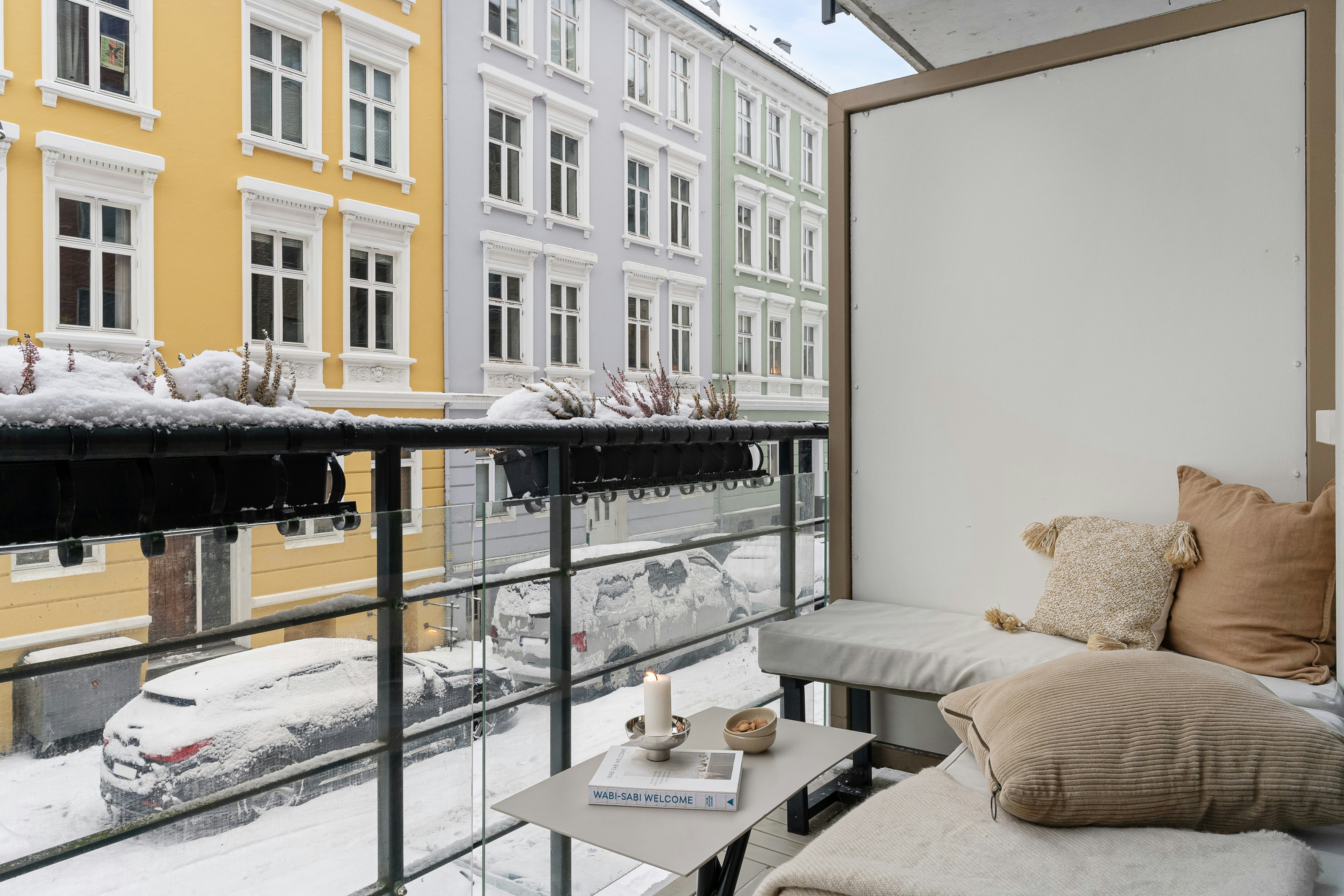 Winterized balcony with weather-resistant furniture and wind protection - Chicago apartments with balconies