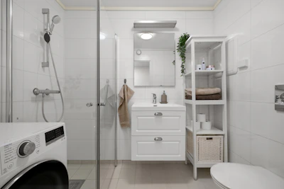 A bathroom with a washer and dryer in it