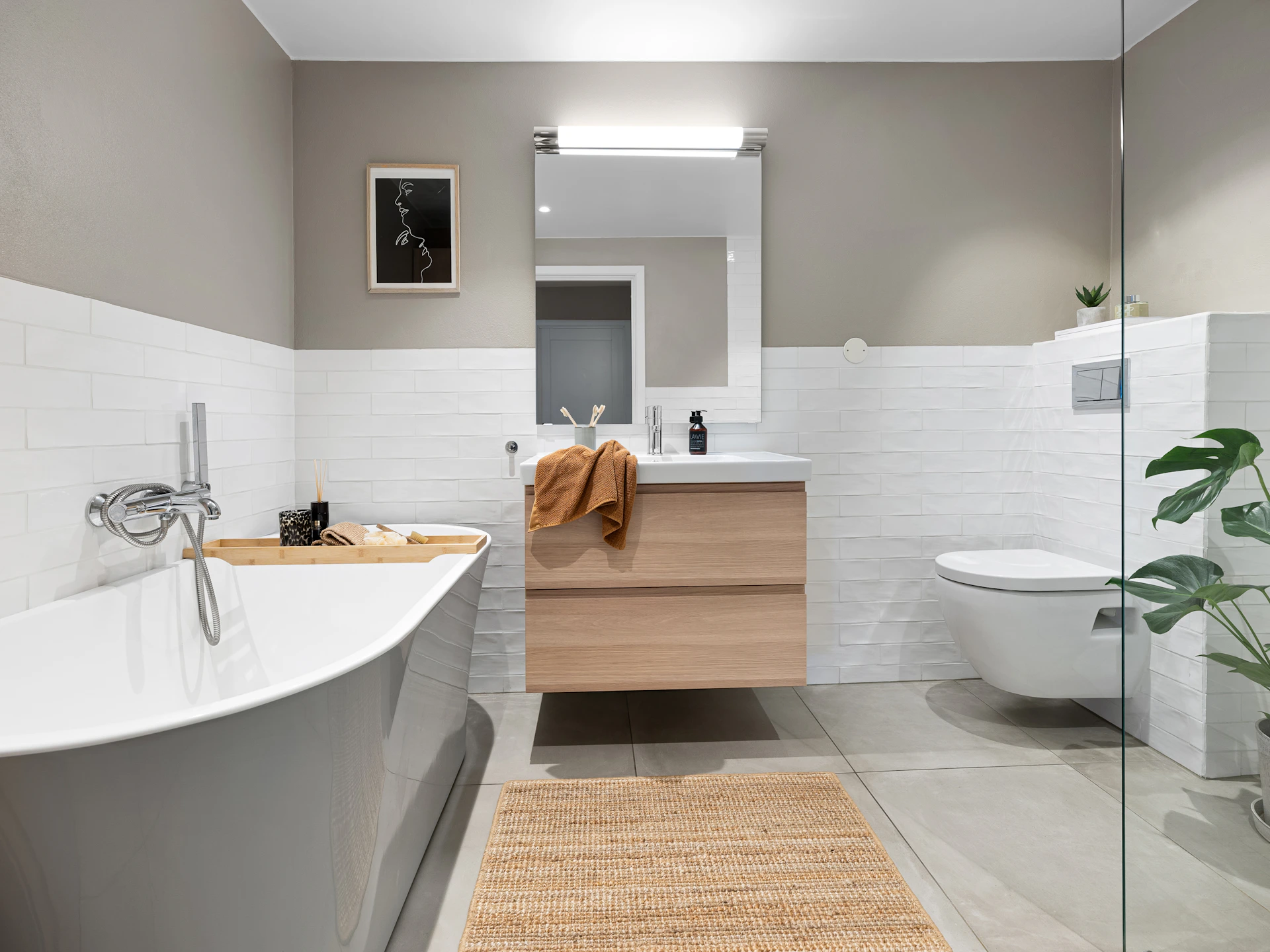 A bathroom with a bathtub, sink, and toilet