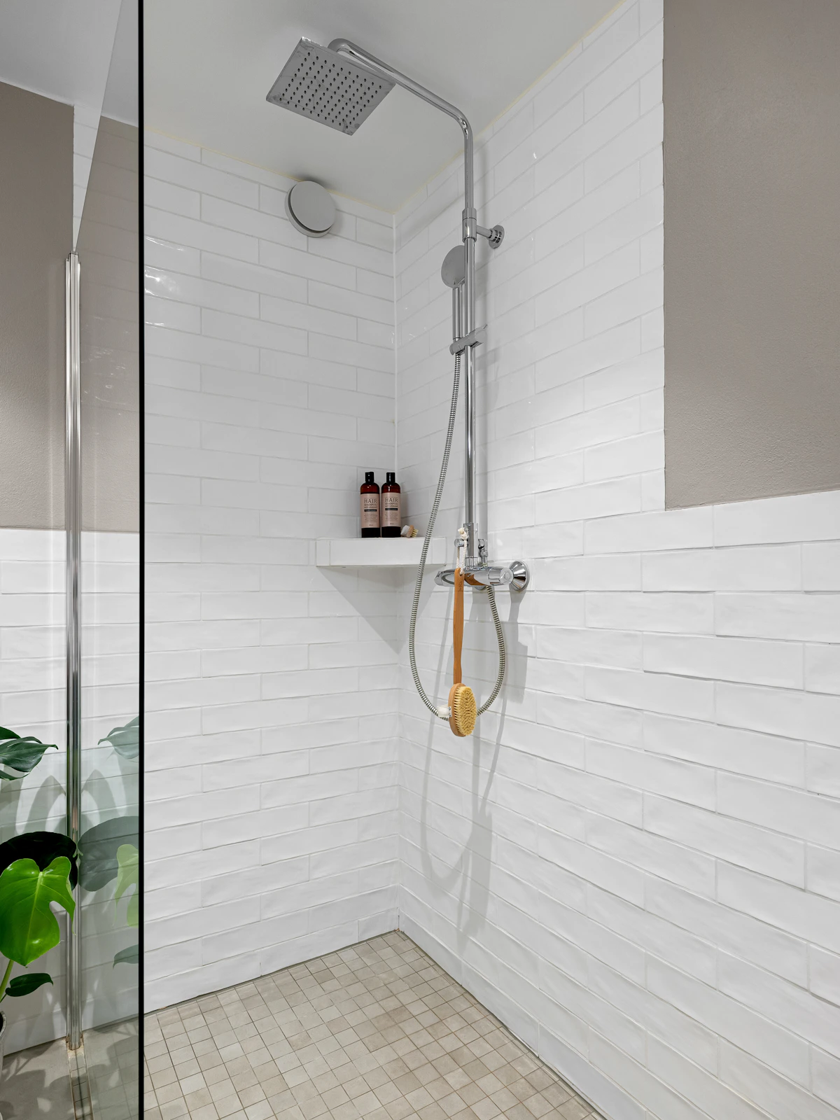 Shower tile corners, glass screen and floor junctions where precise sealing matters