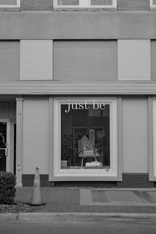 A black and white photo of a store front