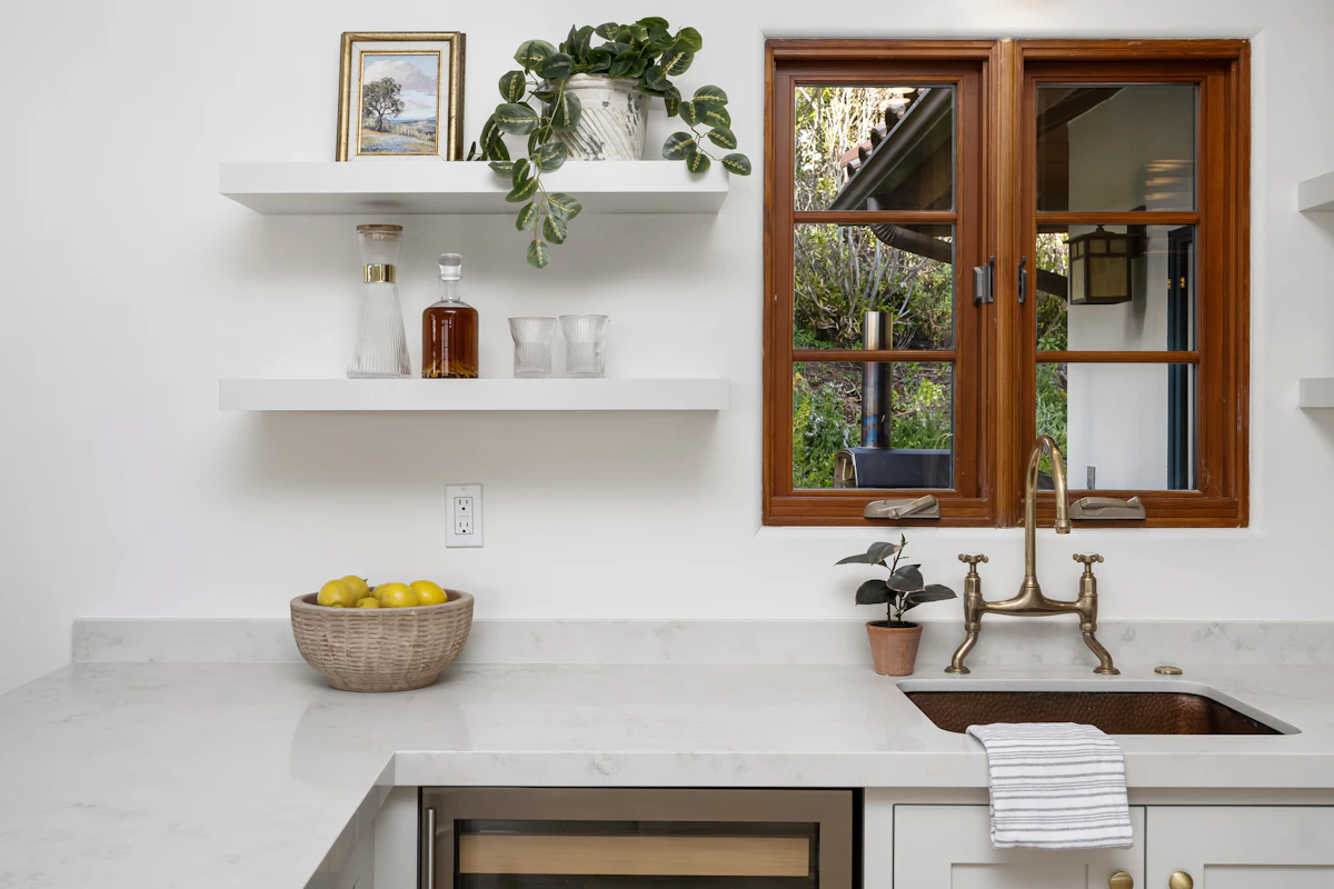 Bright modern kitchen with window and cabinetry