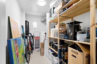 A long narrow room with a lot of storage