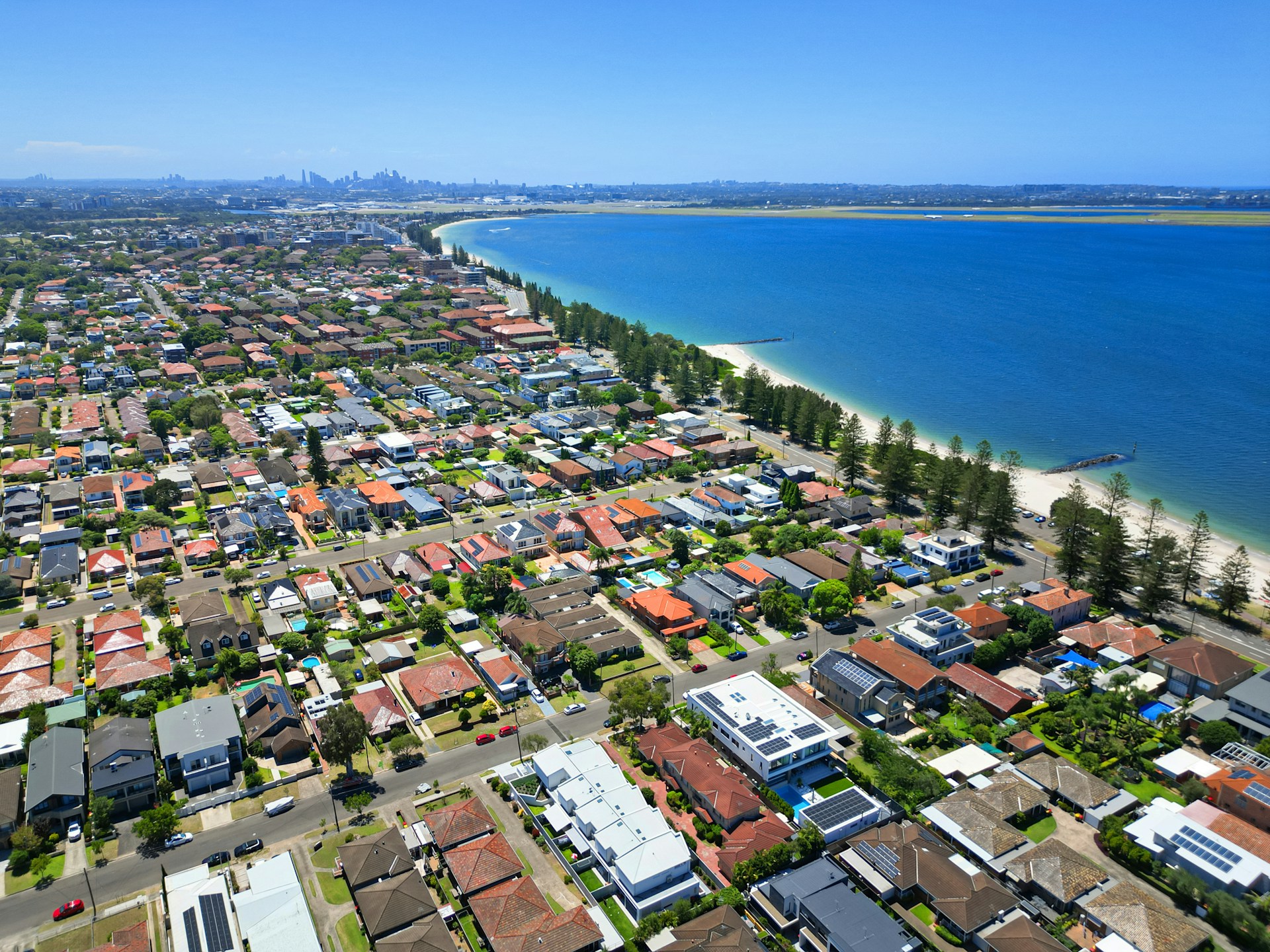 An aerial view of a city next to the ocean