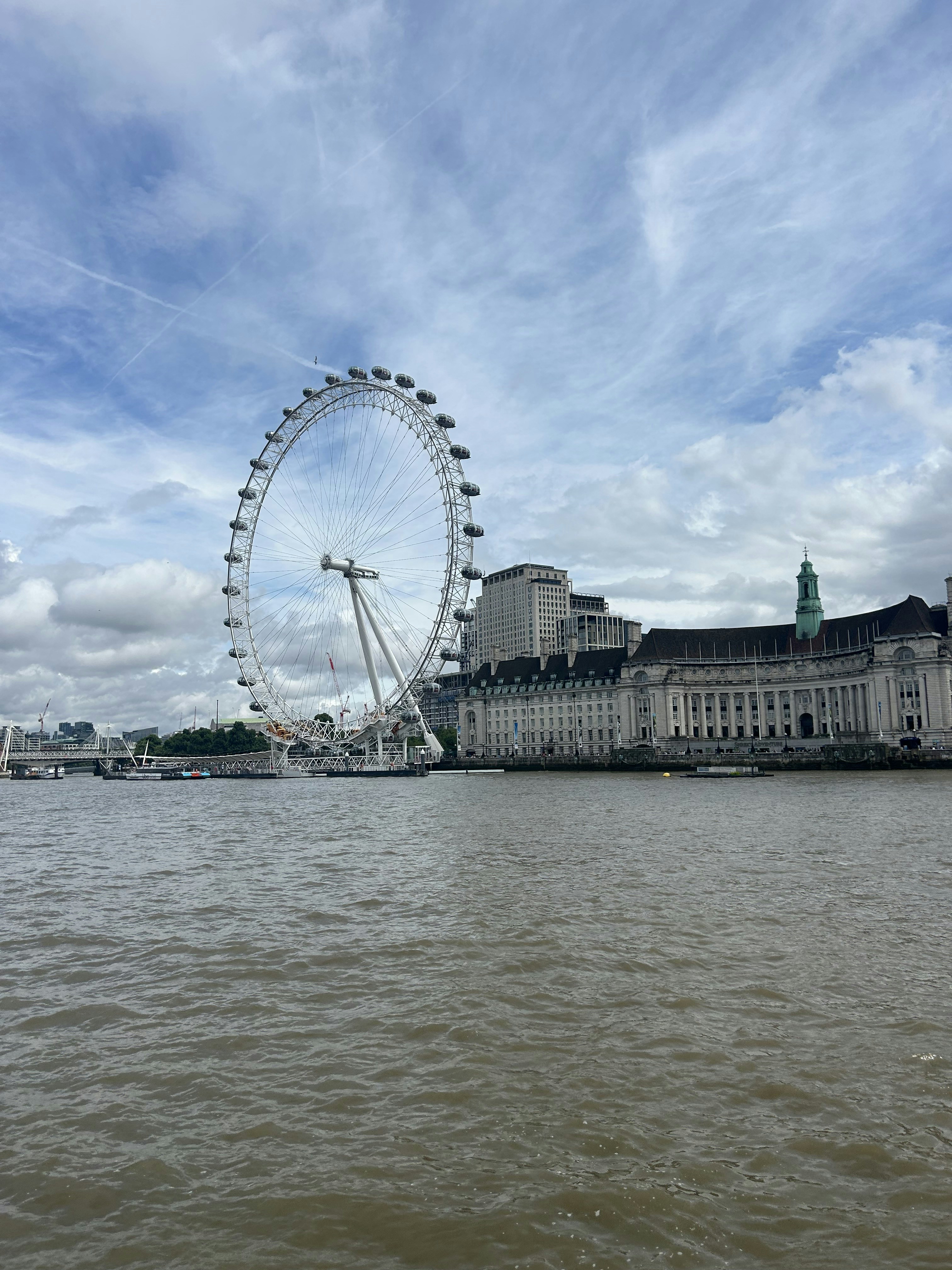 A large ferris wheel in the middle of a body of water