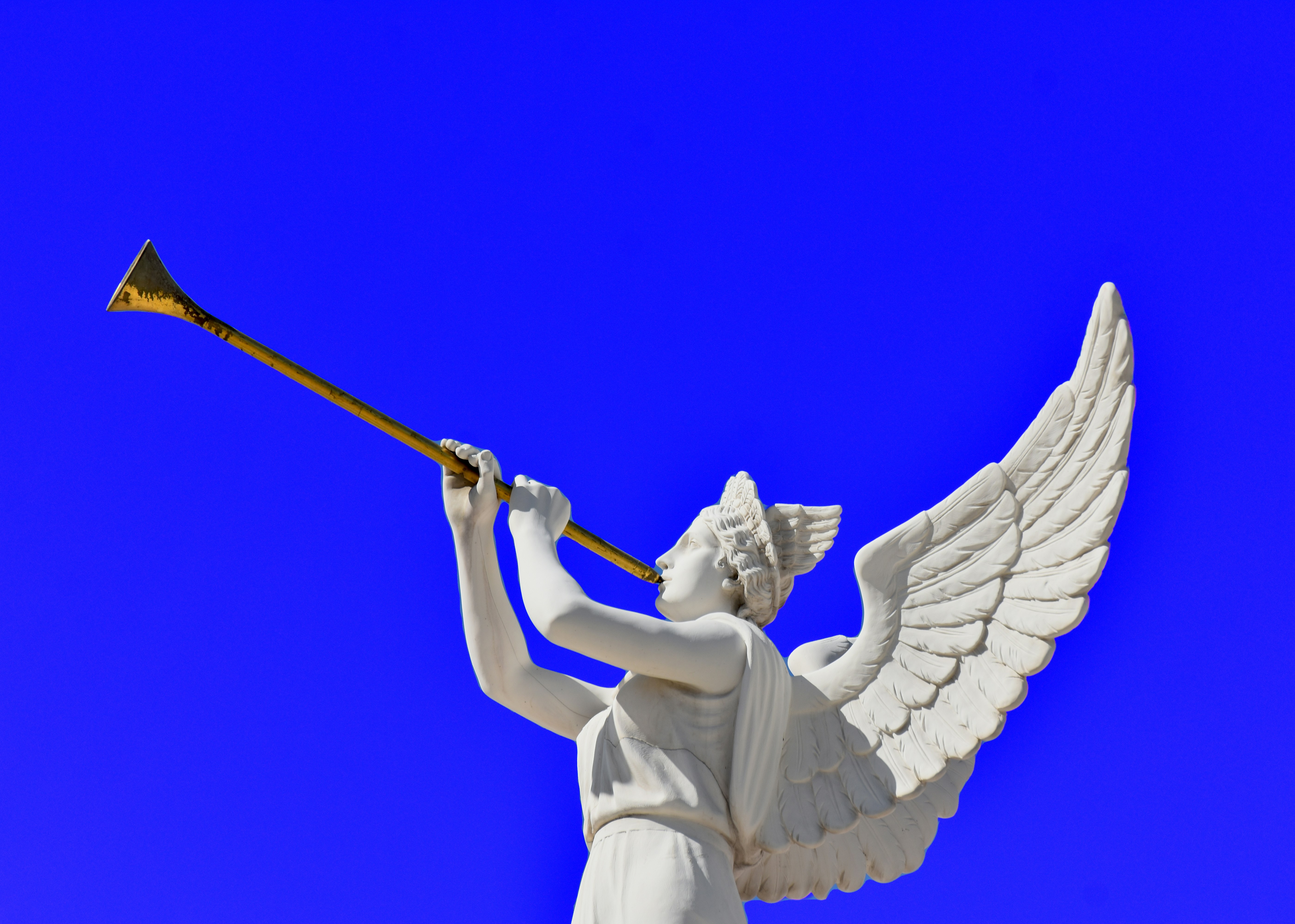 A statue of an angel holding a trumpet
