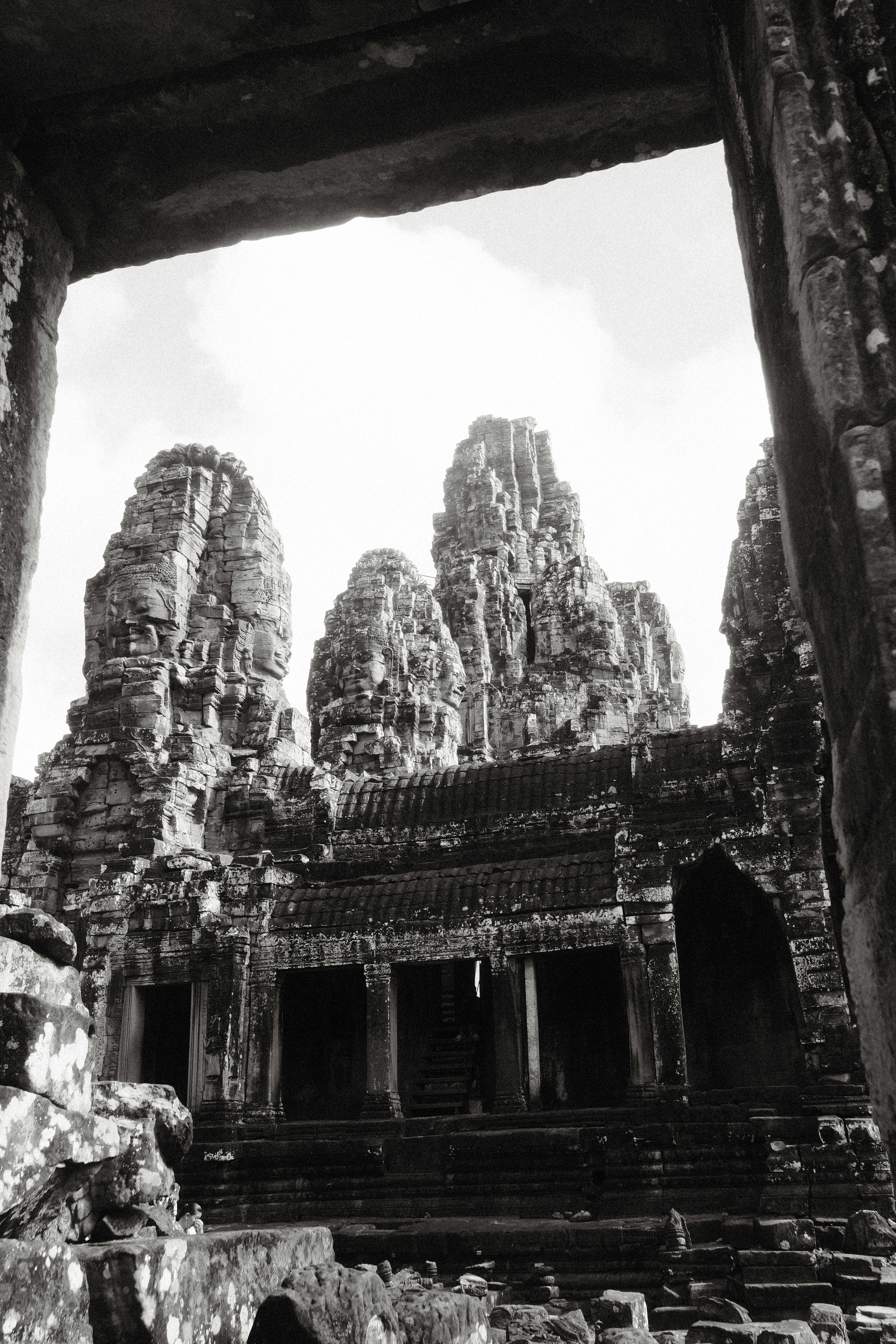 A black and white photo of a doorway to a building