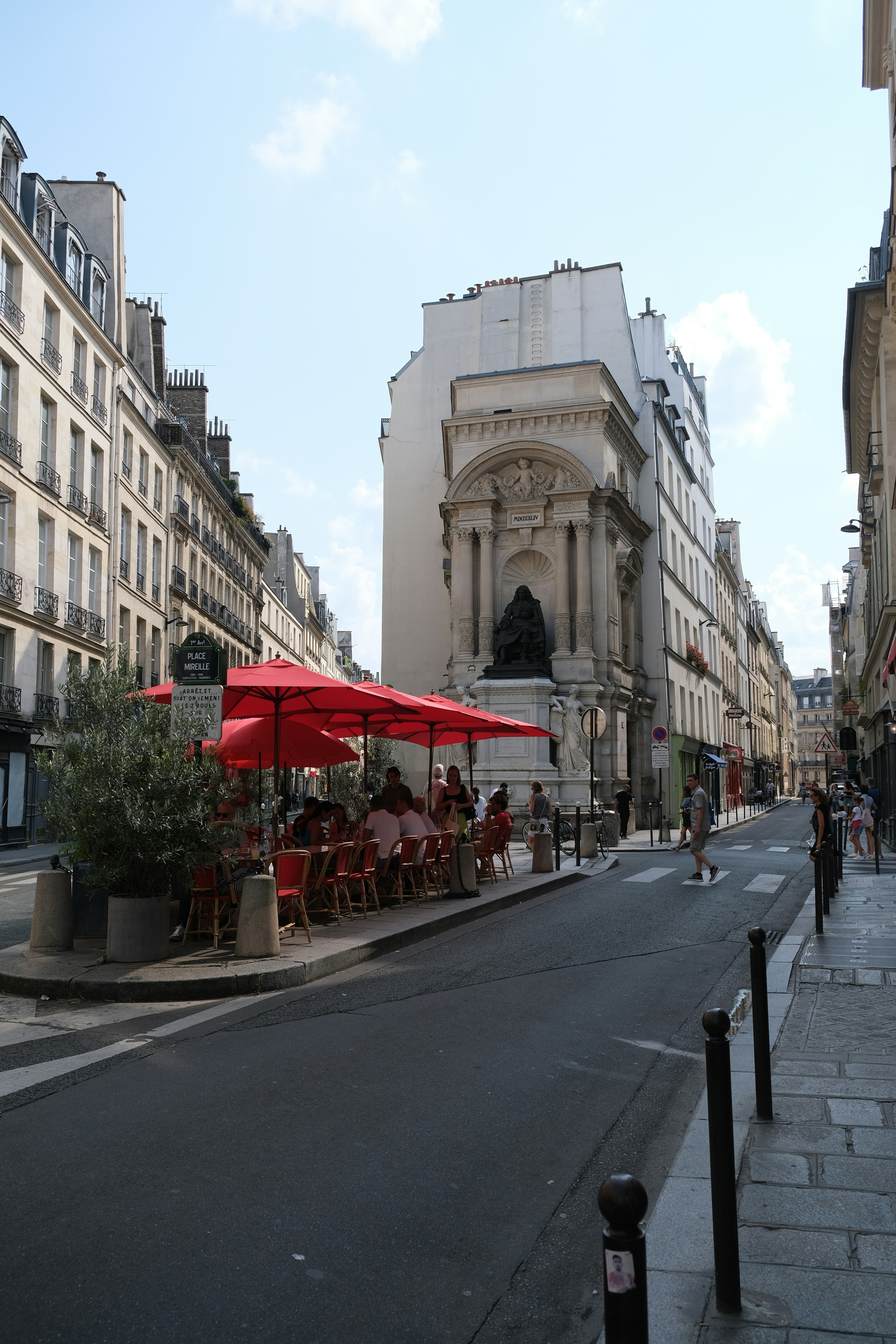 An empty street with tables and chairs on it