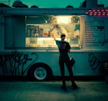 A man standing in front of a food truck