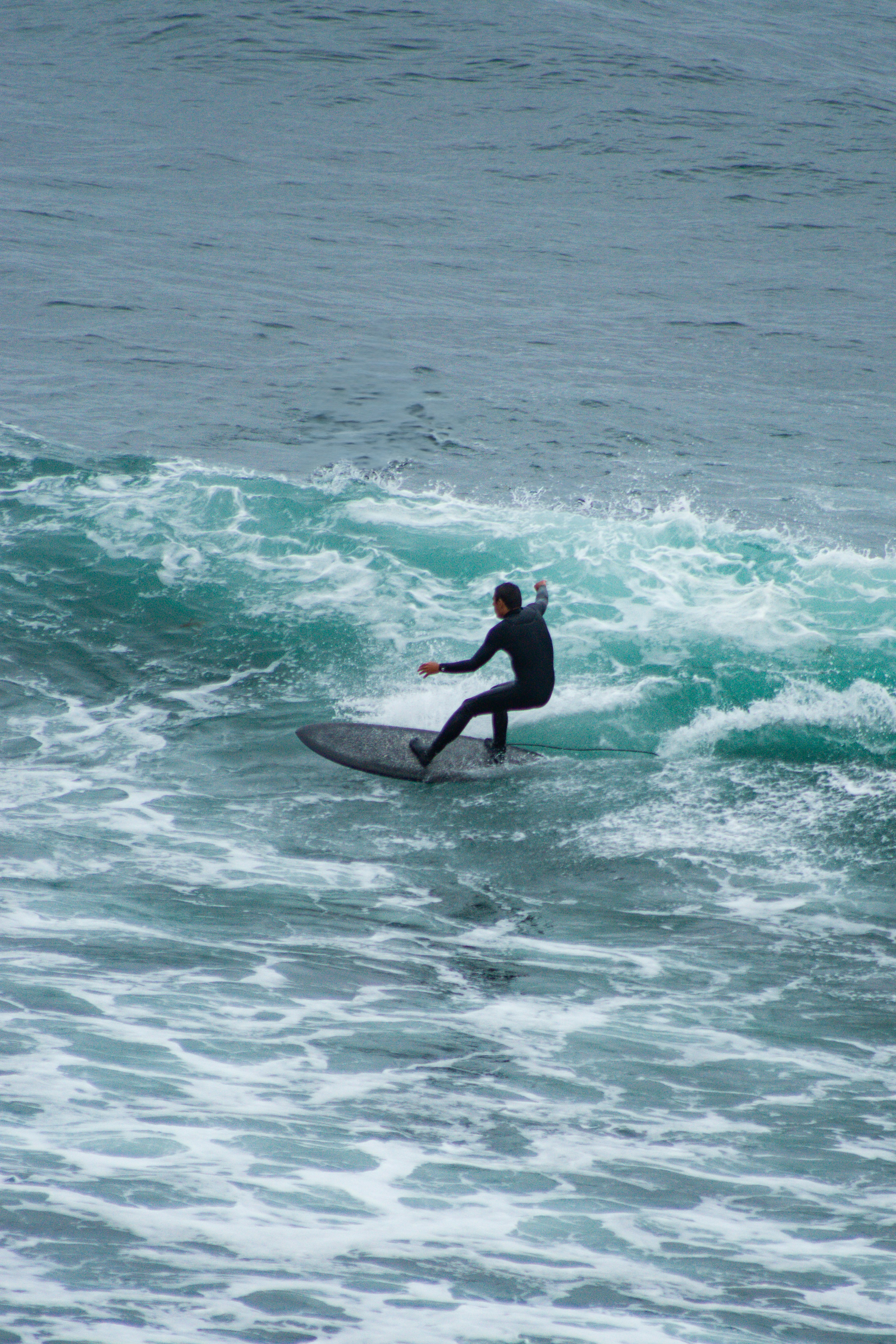 A man riding a wave on top of a surfboard photo – Free Surfing Image on ...