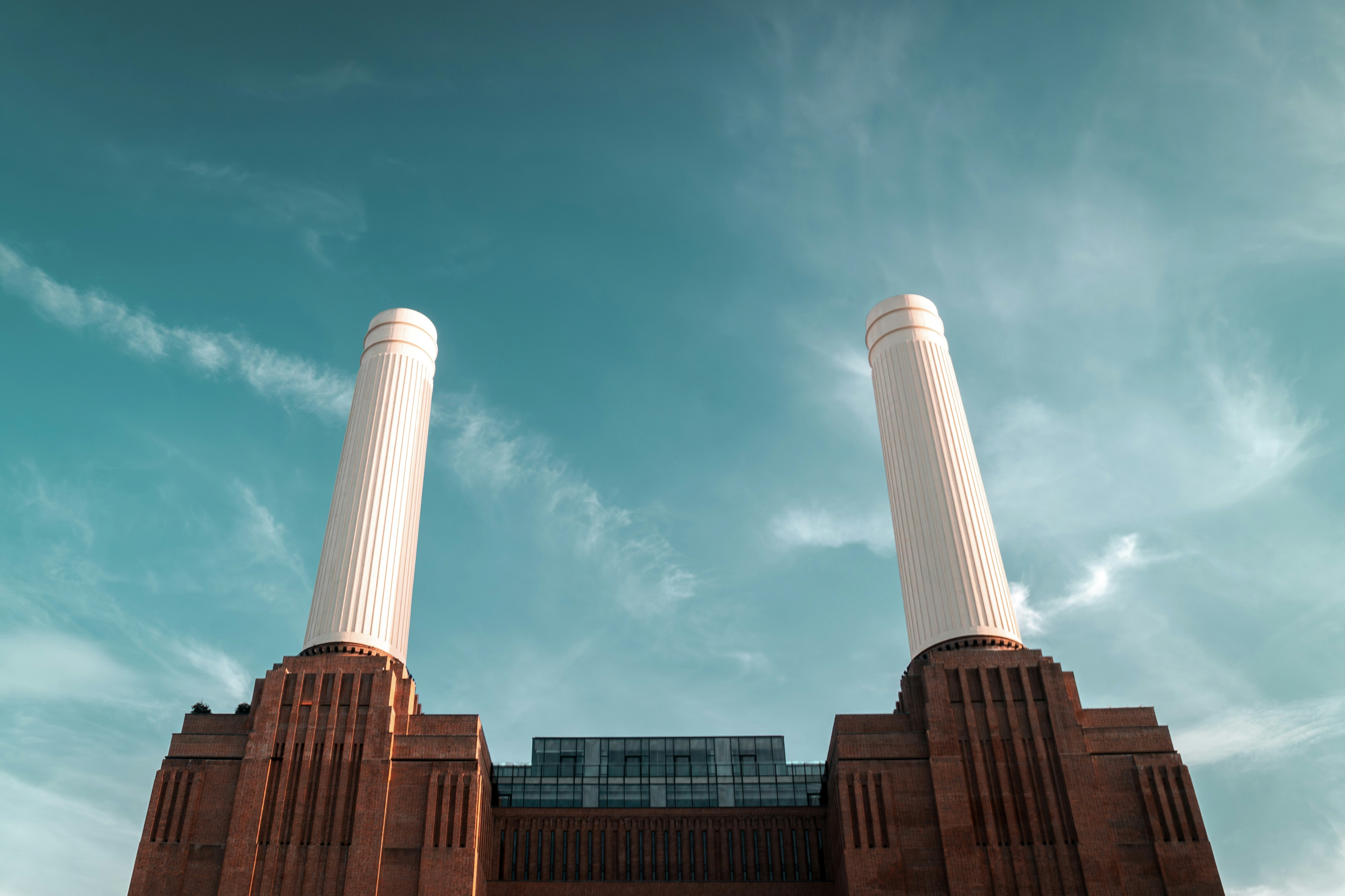 A large brick building with two tall white pillars