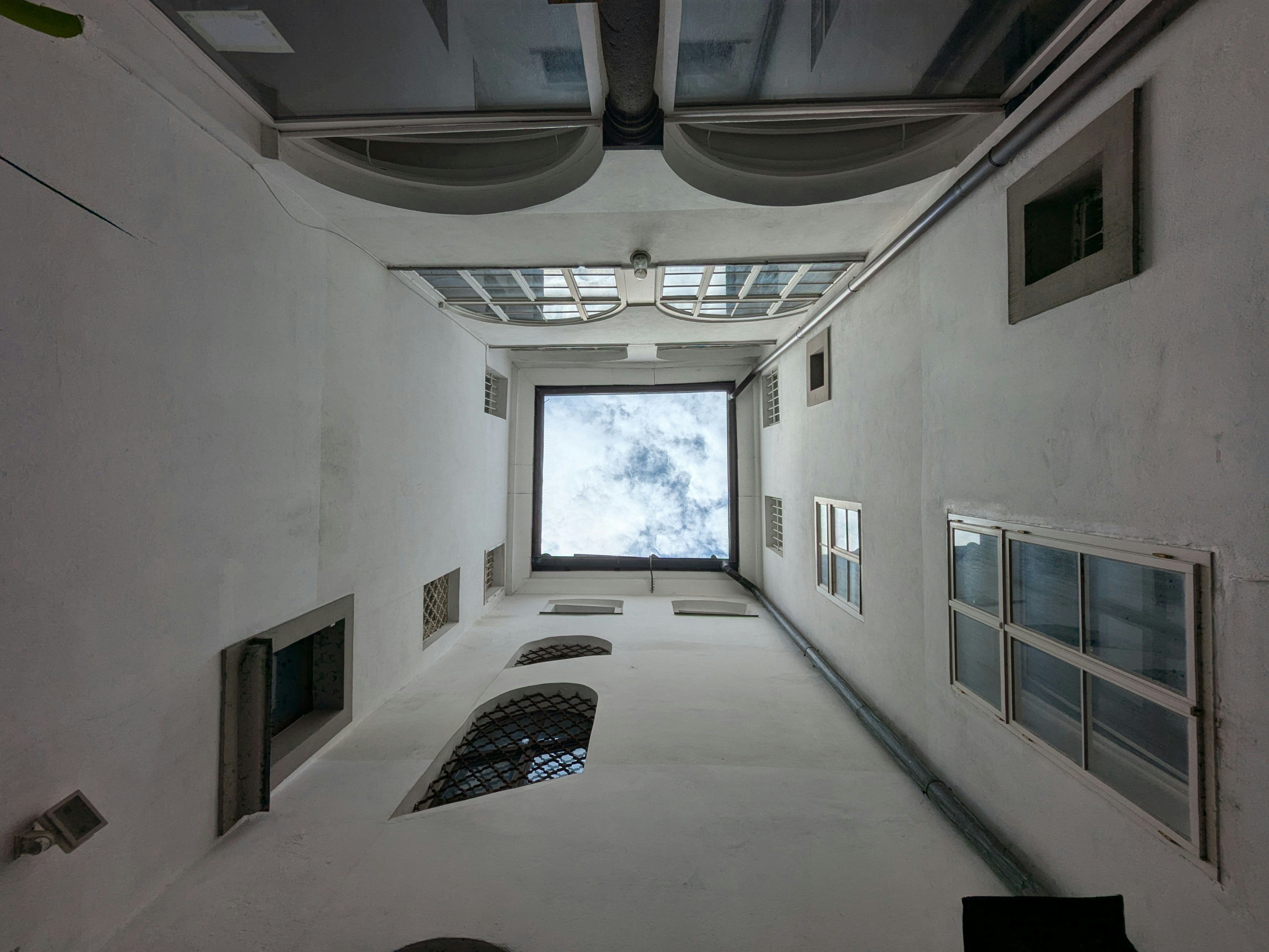 A very long narrow room with a big window