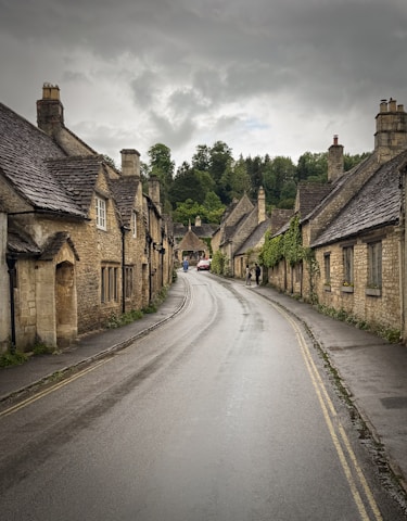 A narrow street with stone buildings on both sides