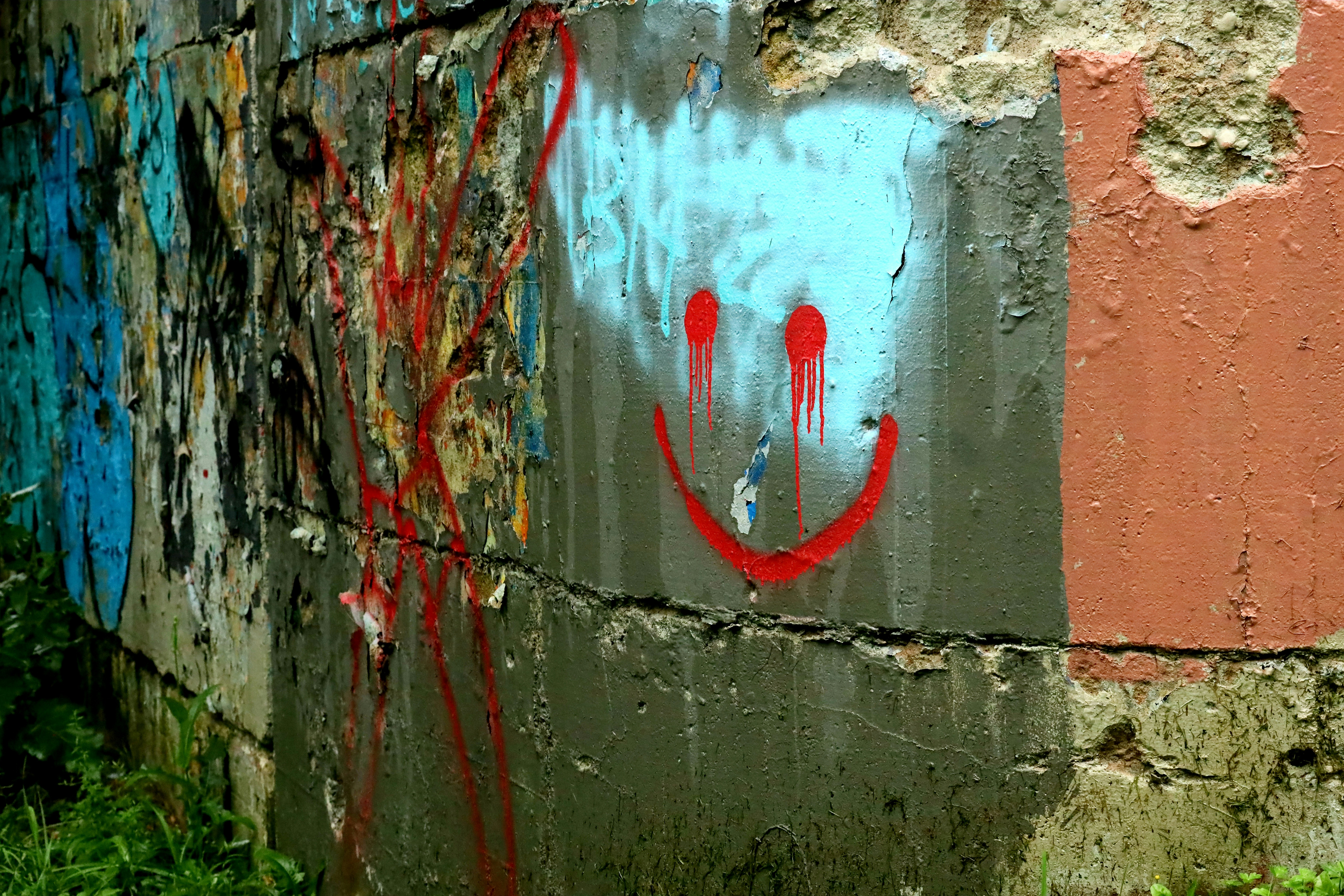 A wall with a smiley face painted on it