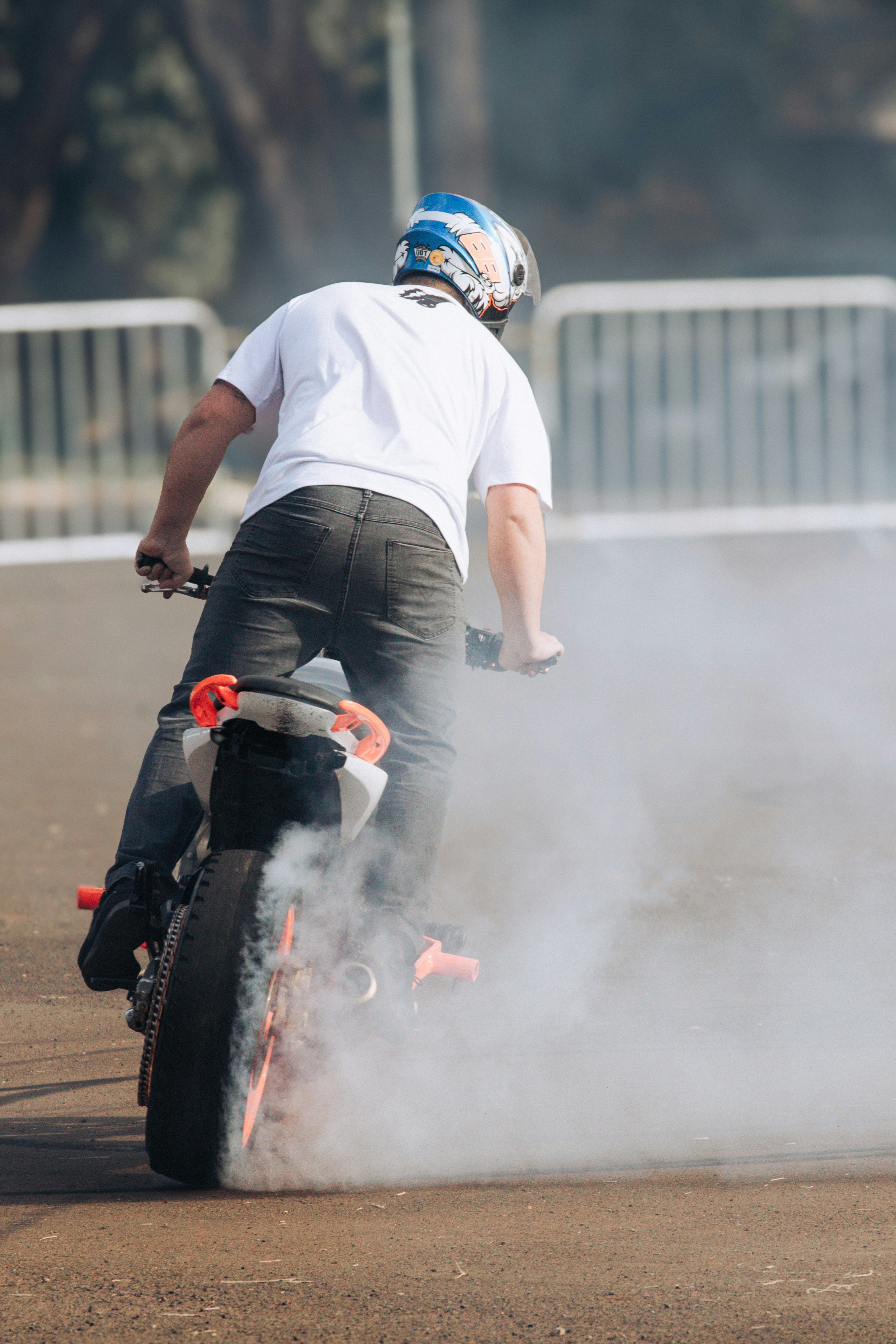 A man riding a bike on a dirt road