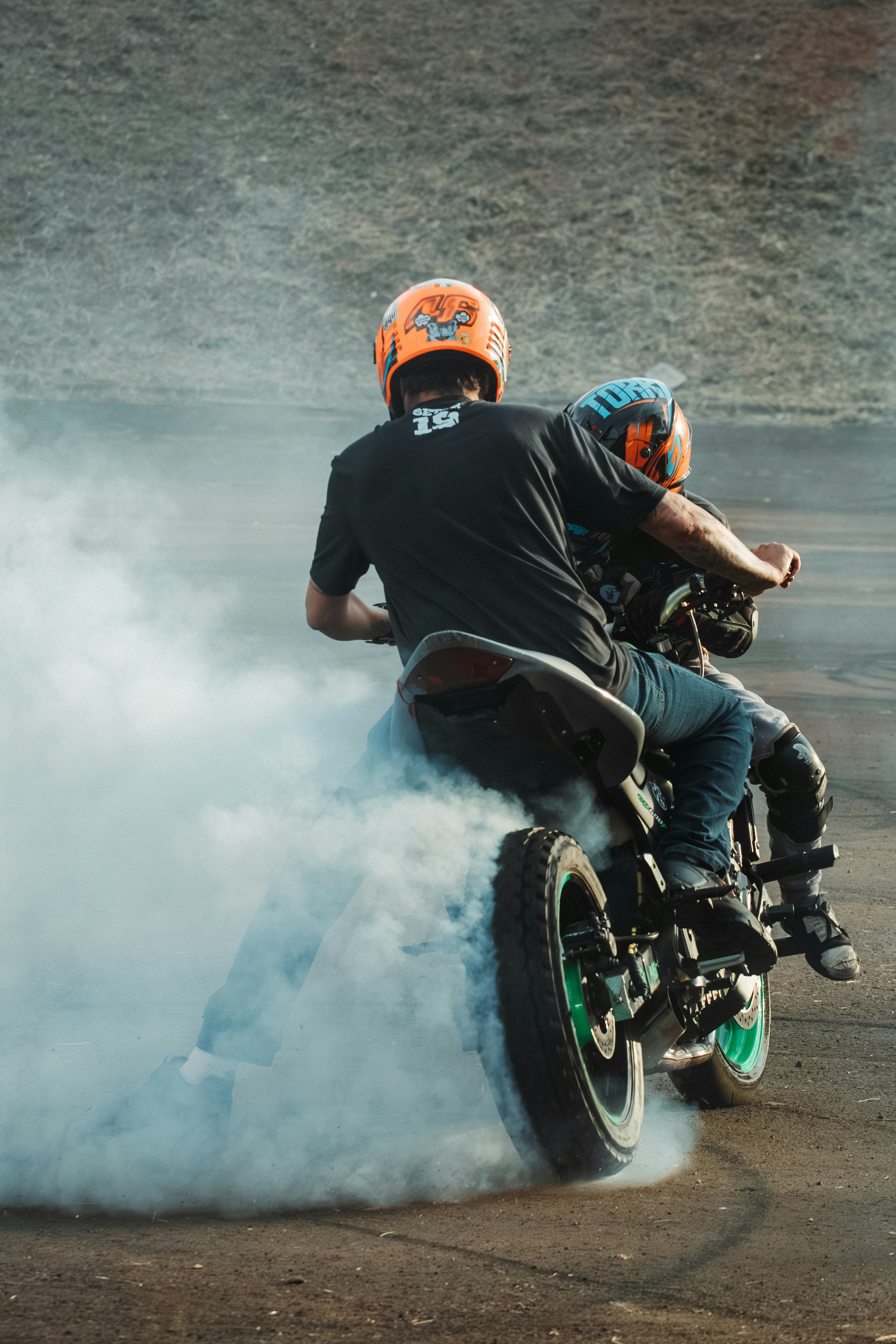 A man riding on the back of a dirt bike
