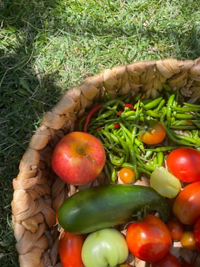 A basket filled with lots of different types of vegetables