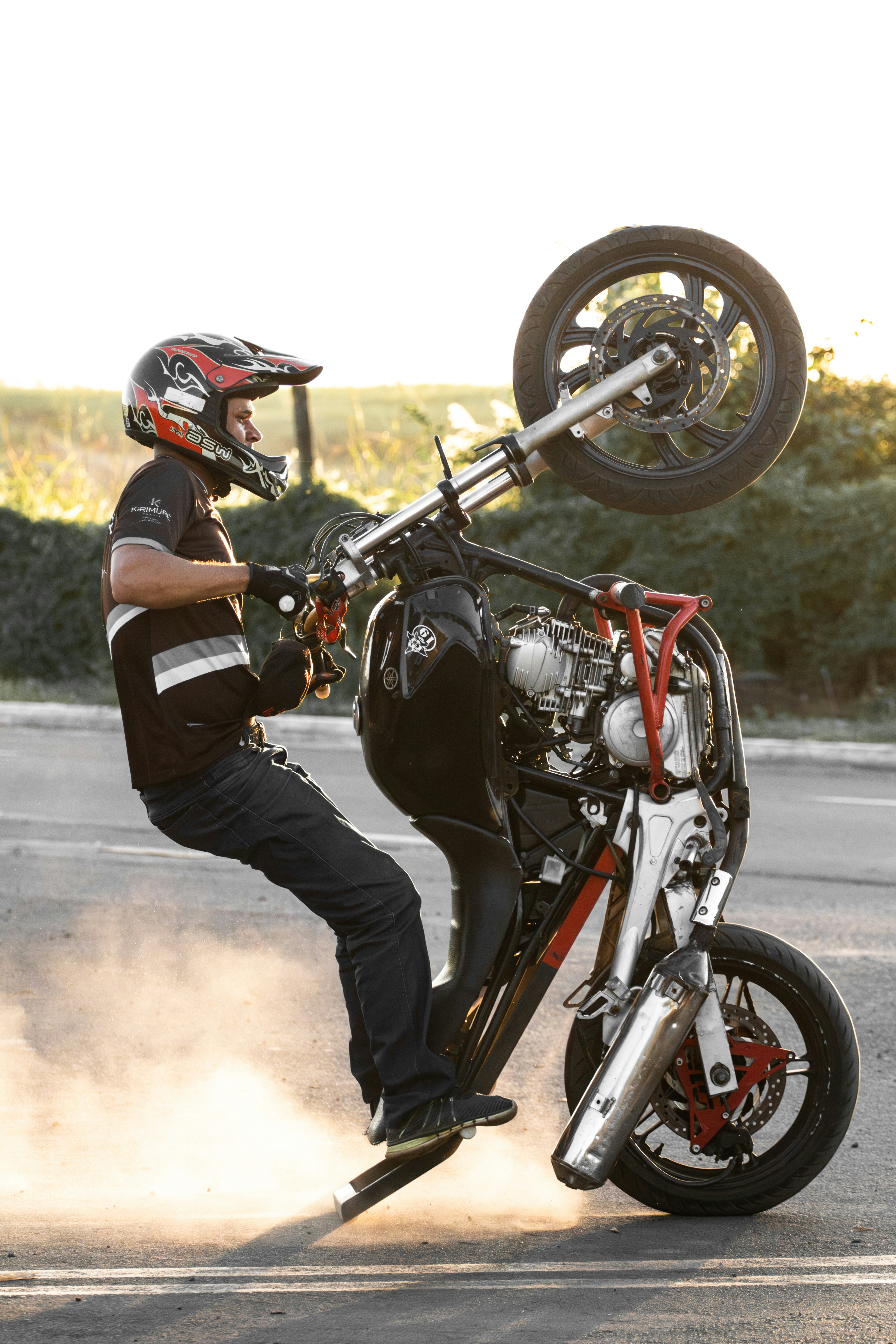 A man doing a trick on a motorcycle