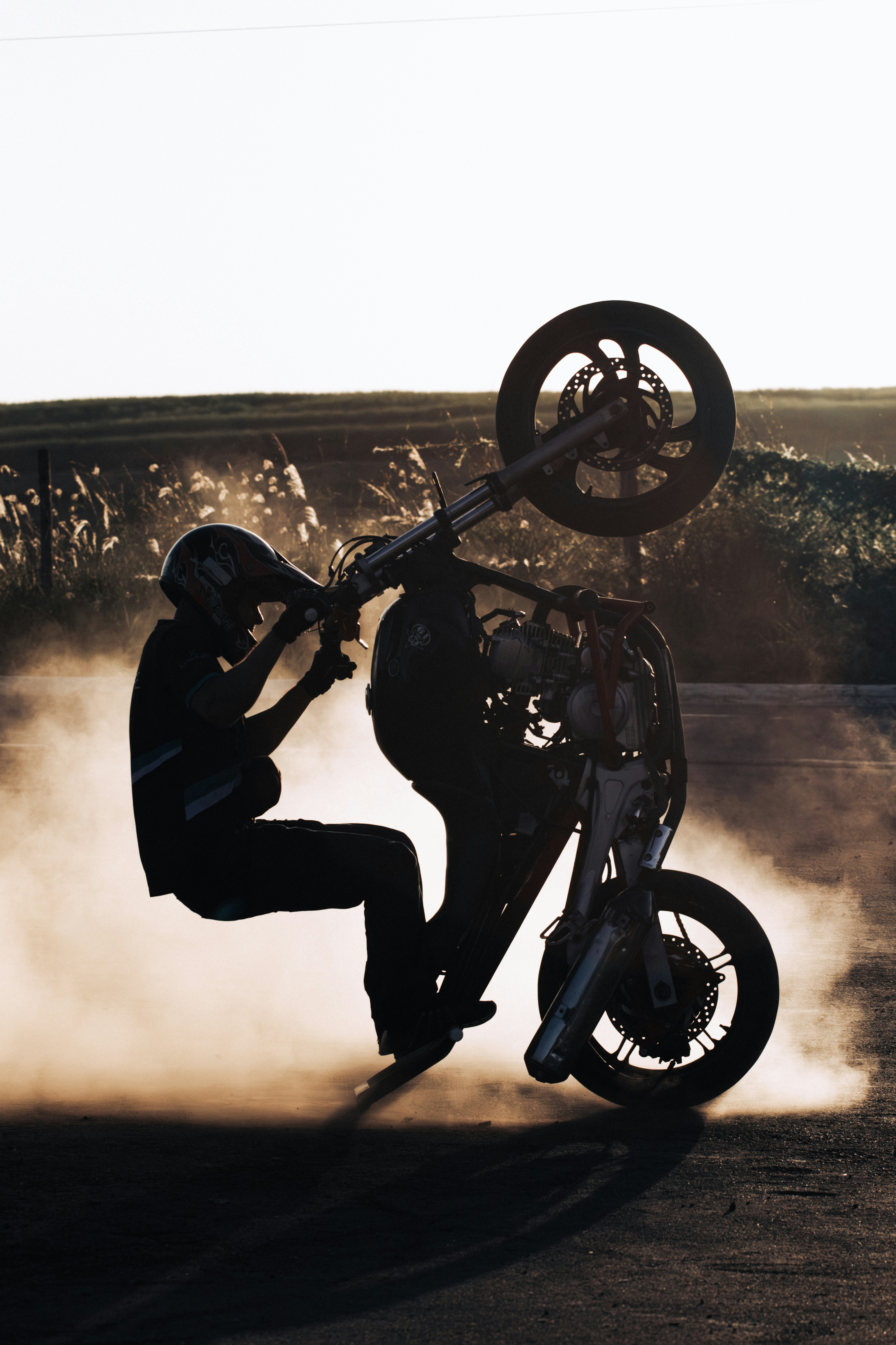 A person doing a wheelie on a motorcycle