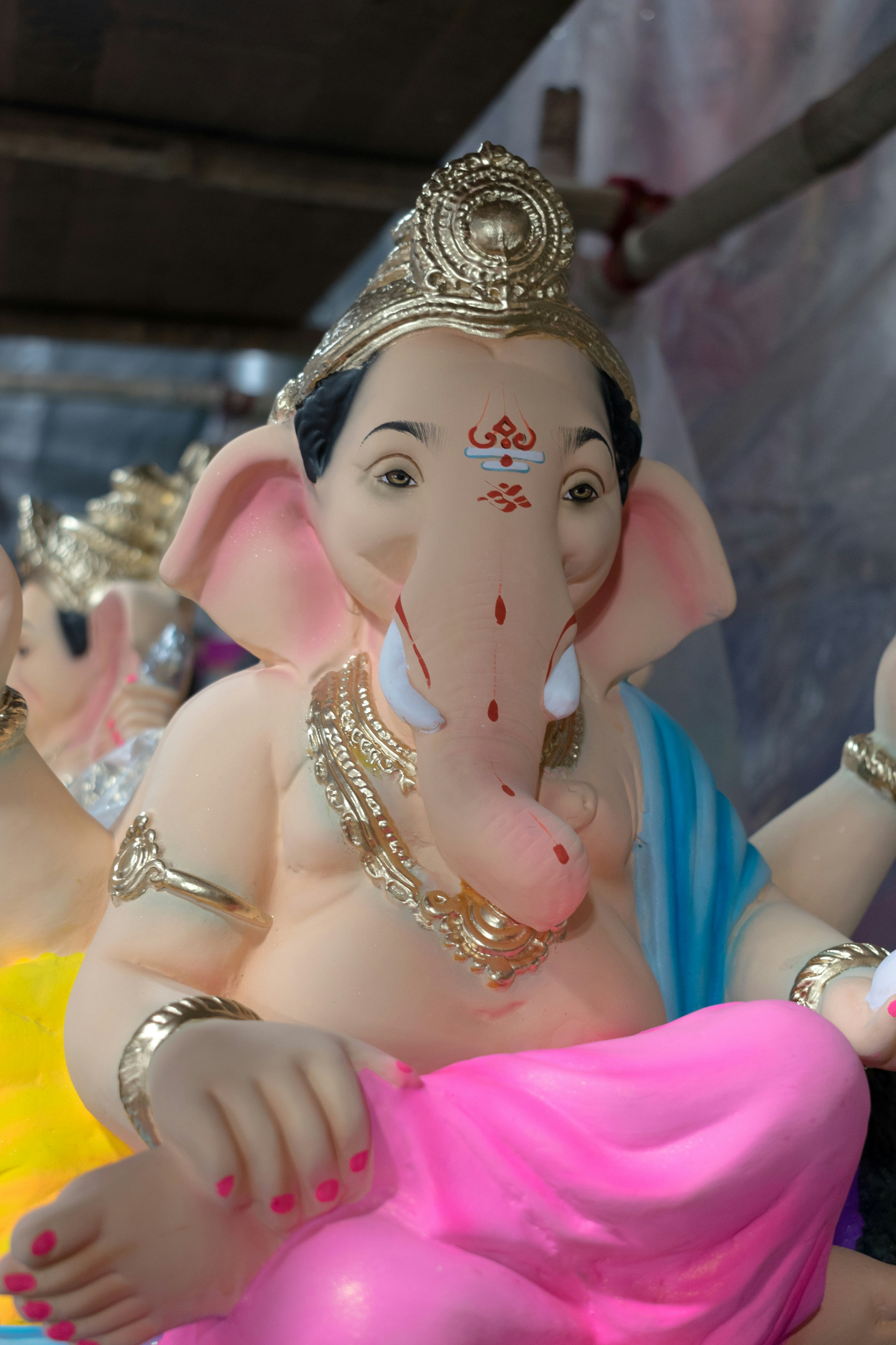 A statue of an elephant with a crown on it's head