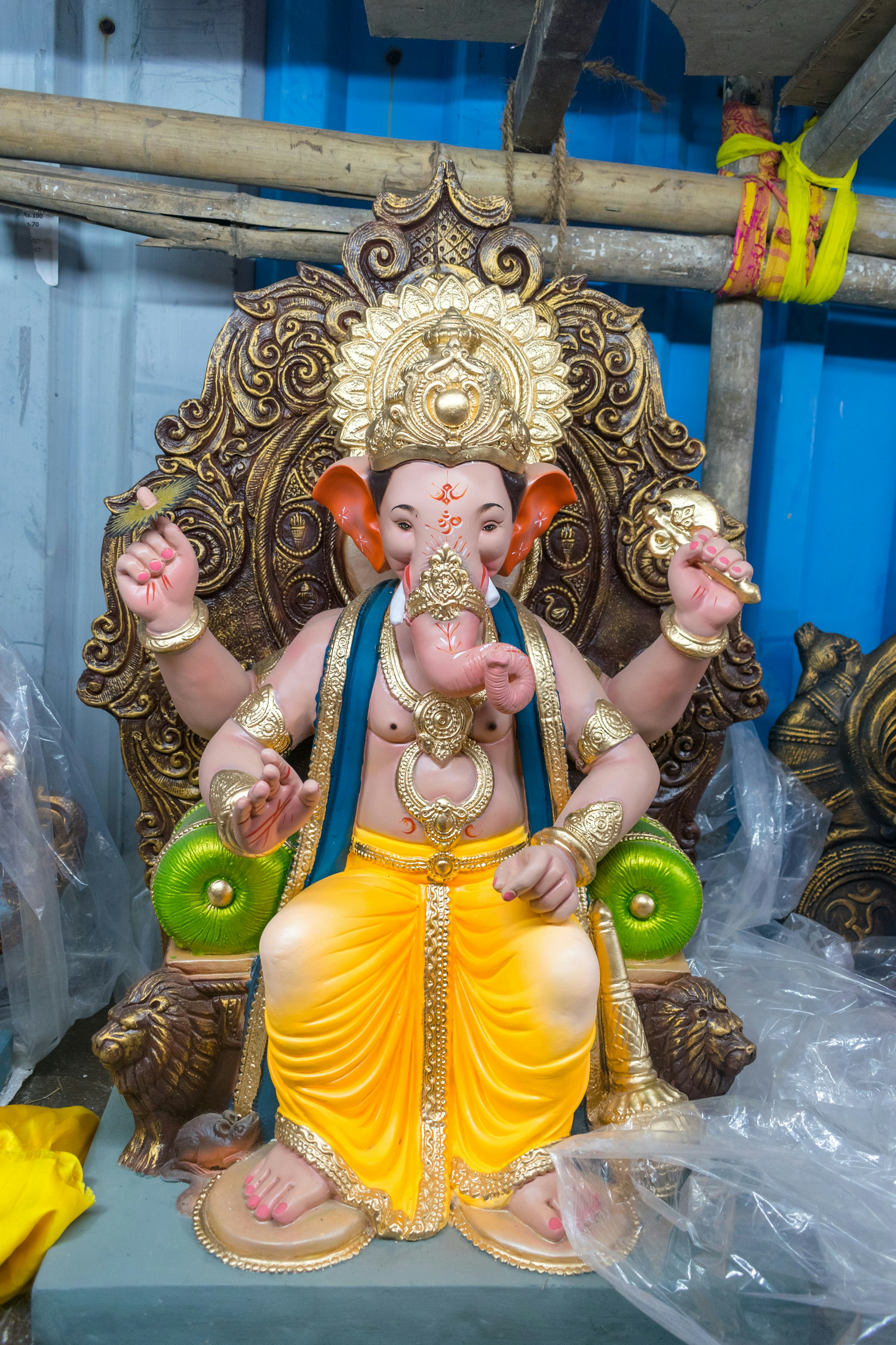 A statue of an elephant sitting on top of a chair