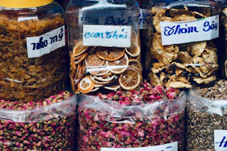 A variety of spices are on display in a store