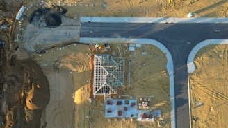 An aerial view of a road and a construction site