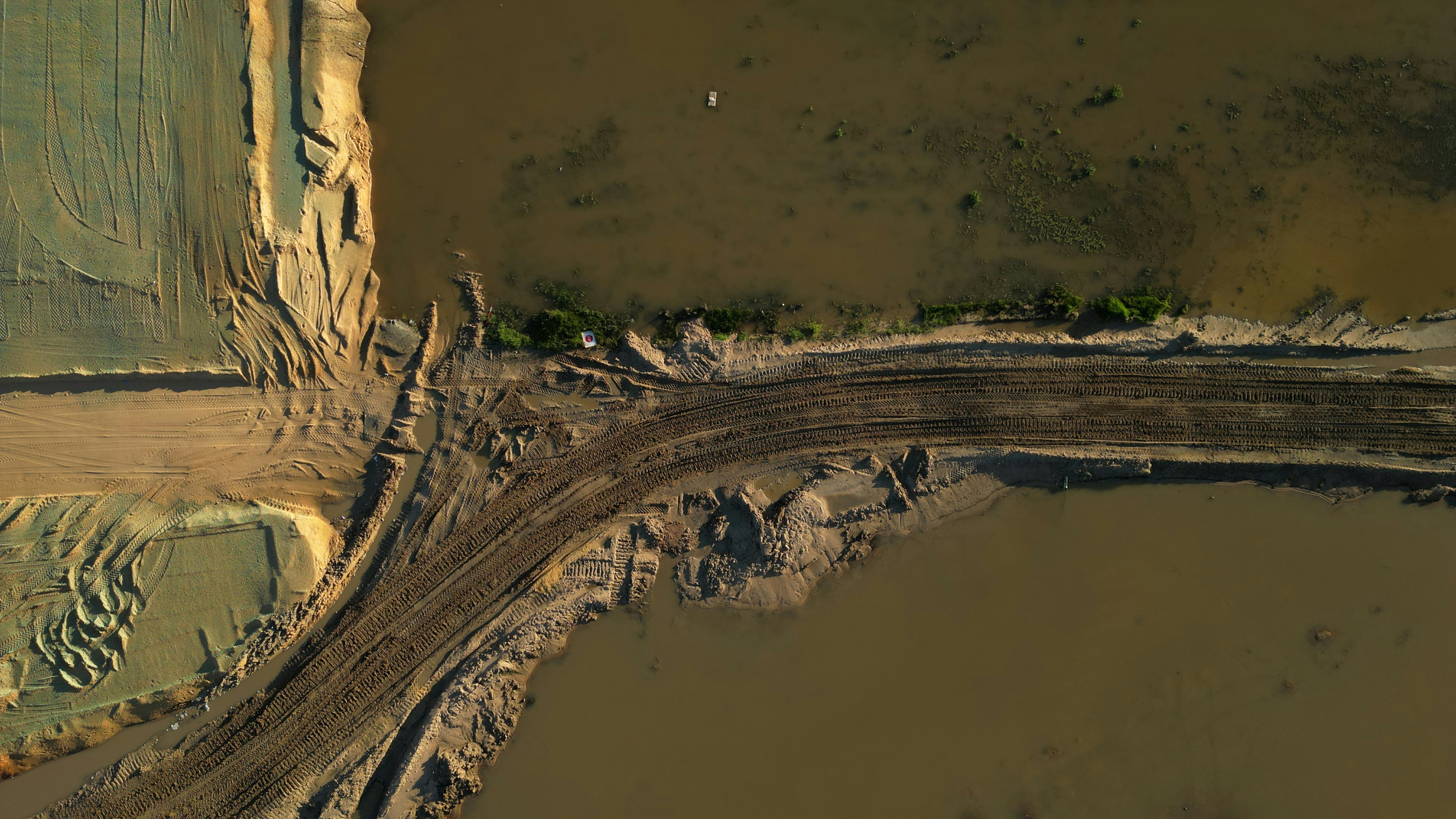 Construction site tracks in mud after rain