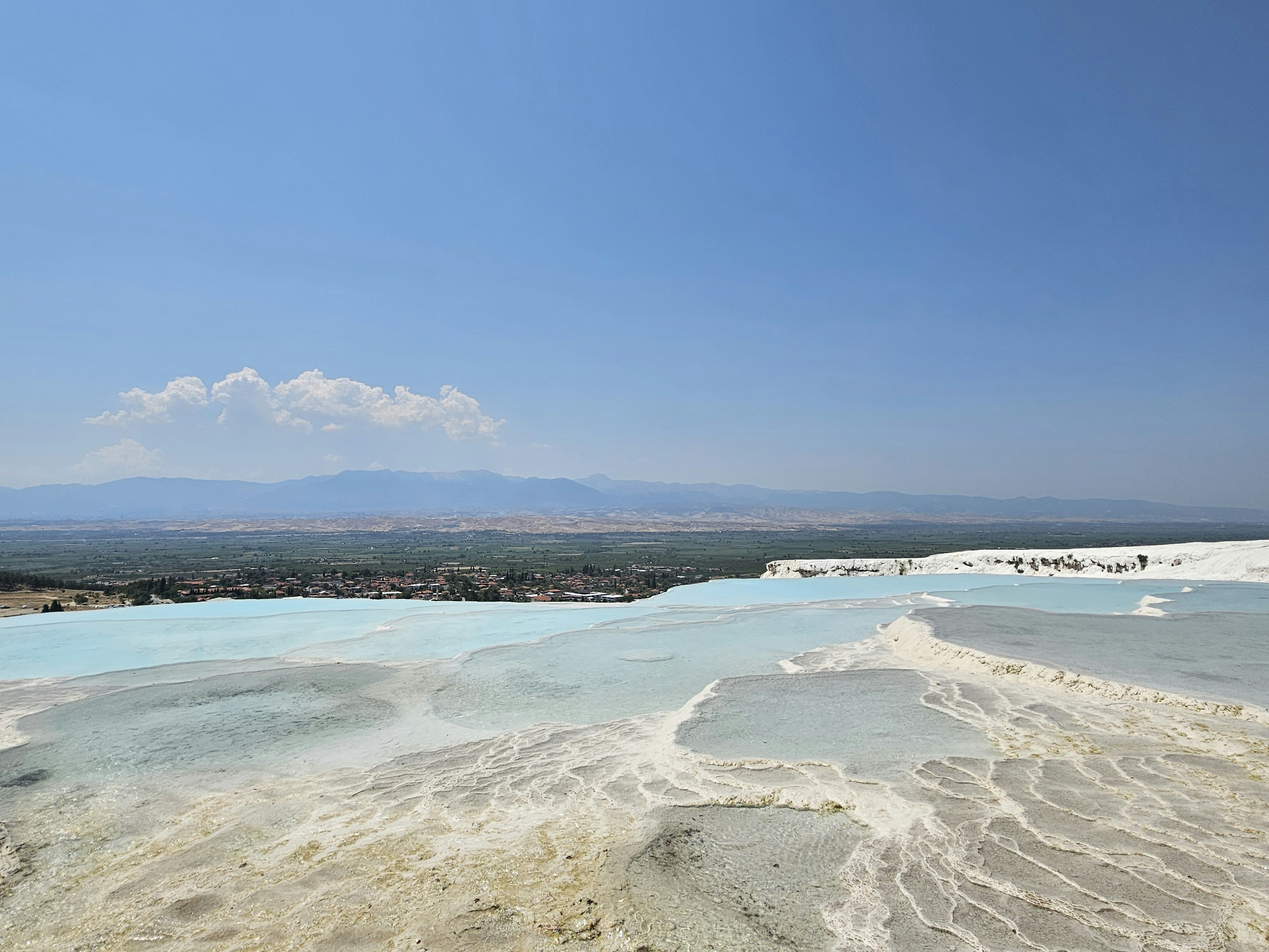 A view of a body of water with a mountain in the background