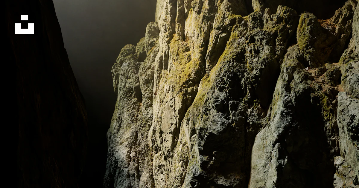 A very tall mountain with some very pretty rocks photo – Free Cave ...