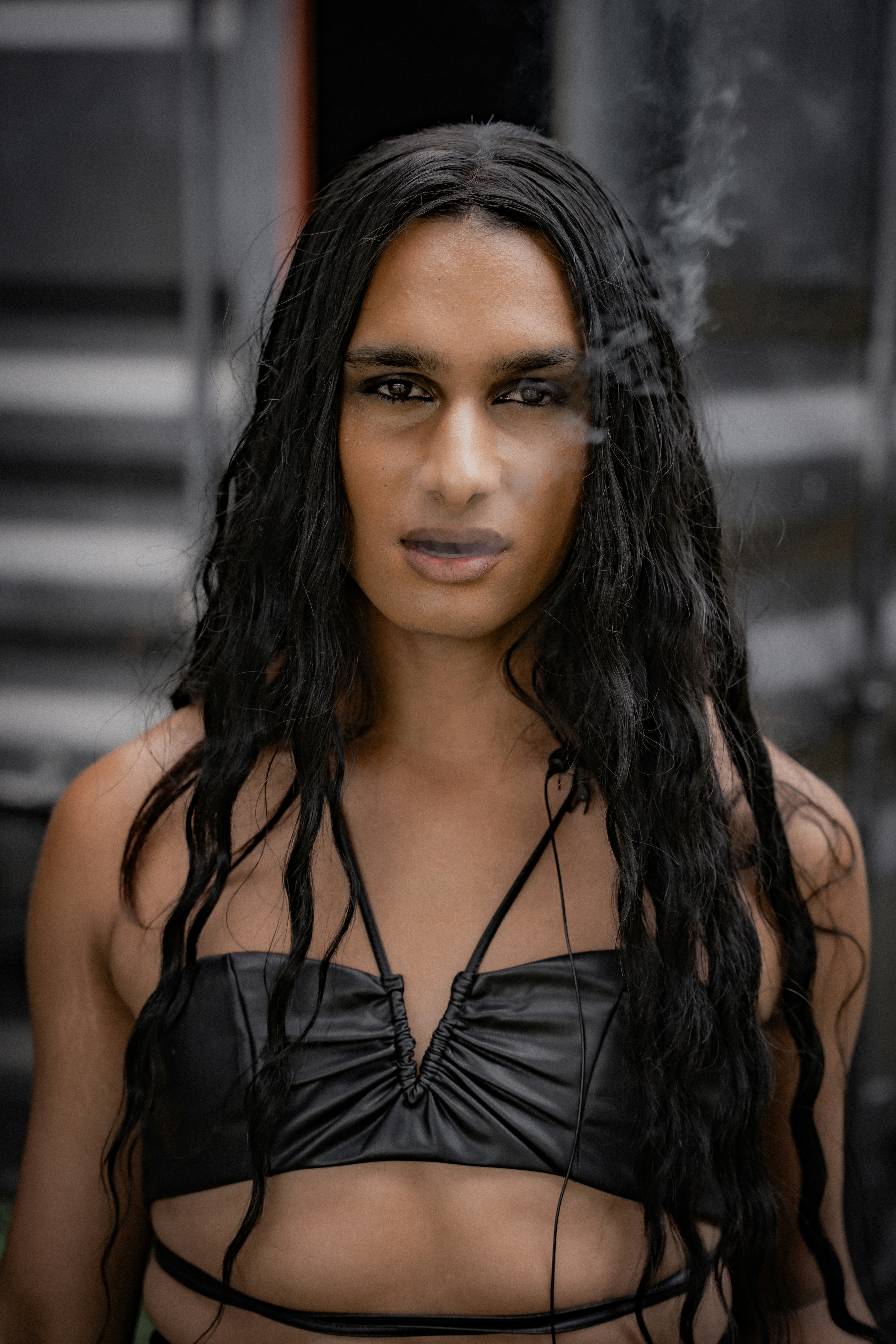 A woman with long hair wearing a black bikini top