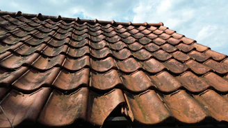 A close up of a roof with a sky background