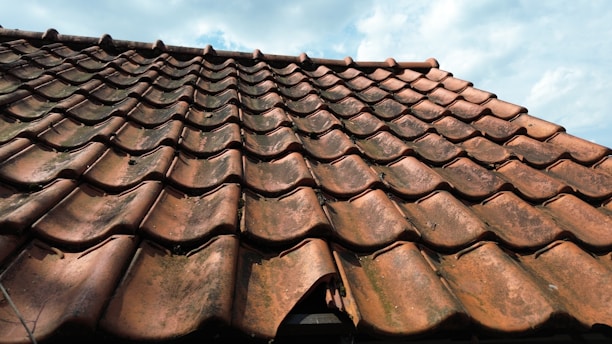 A close up of a roof with a sky background
