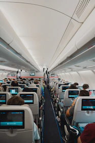 A large airplane with many people sitting in it