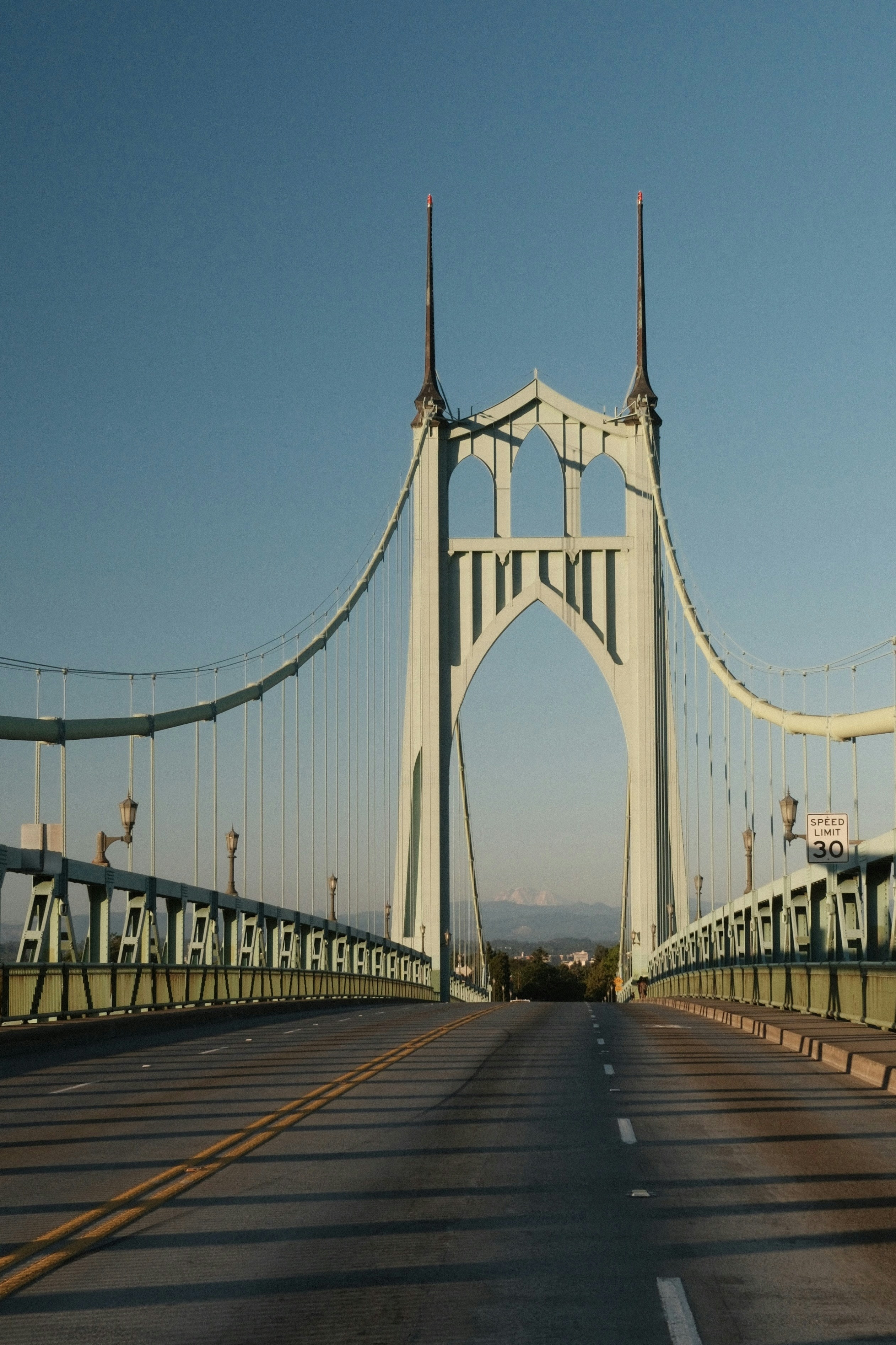 A view of a bridge from the inside of a car