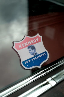 A sticker on the side of a car that says kennedy for president
