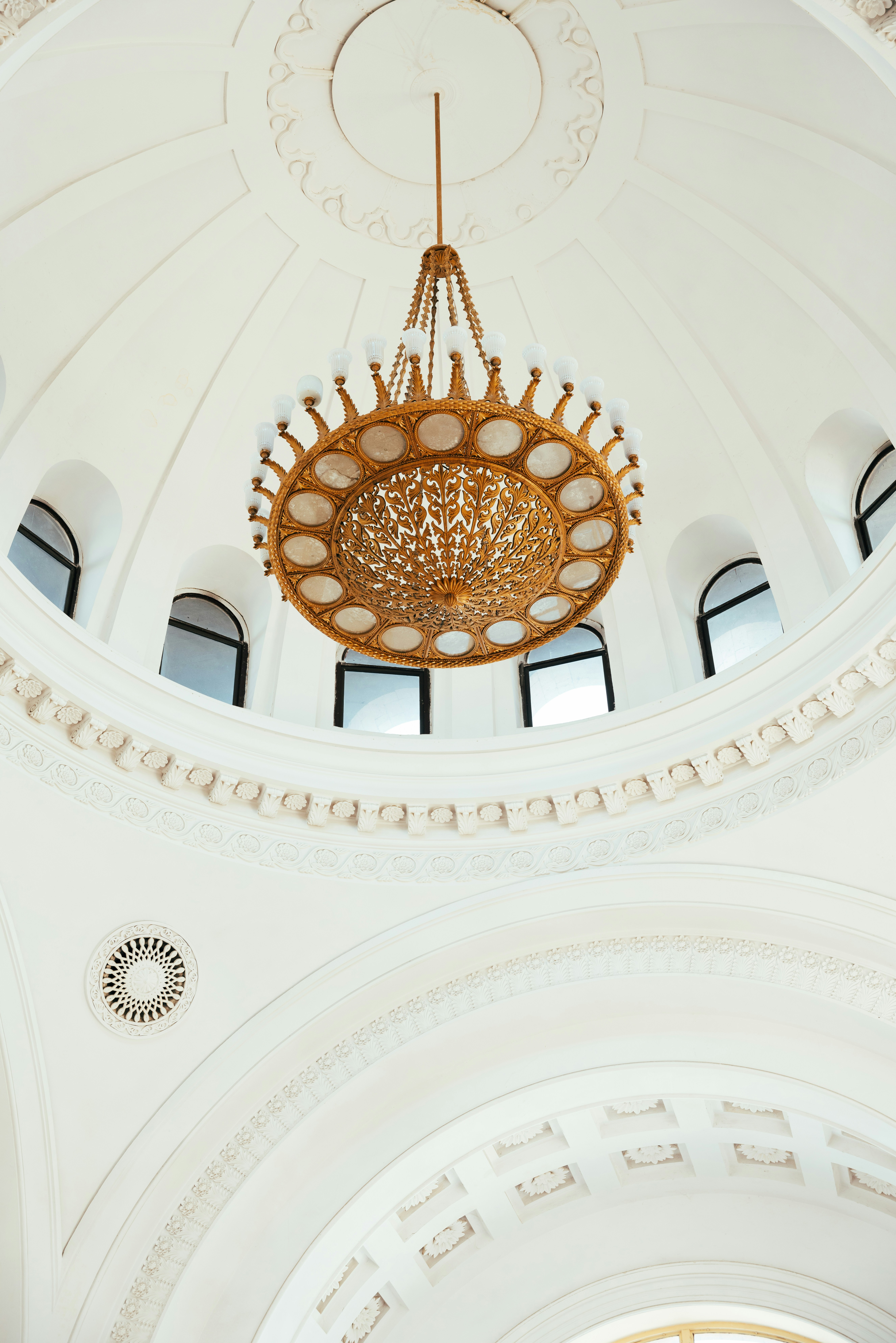 A chandelier hanging from the ceiling of a building