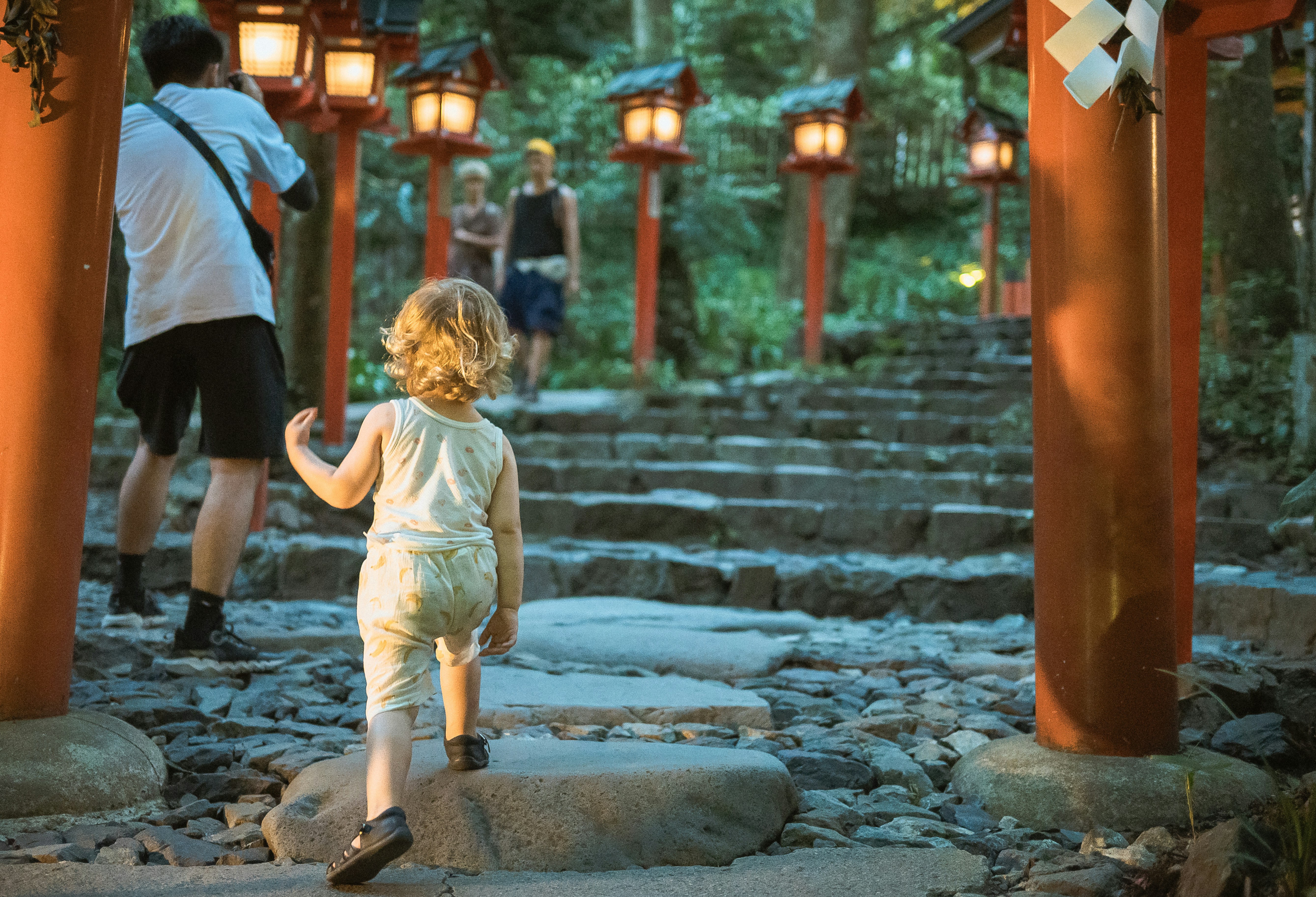 A small child walking up a set of steps