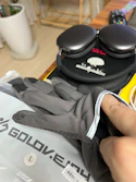 A pair of gloves sitting on top of a table