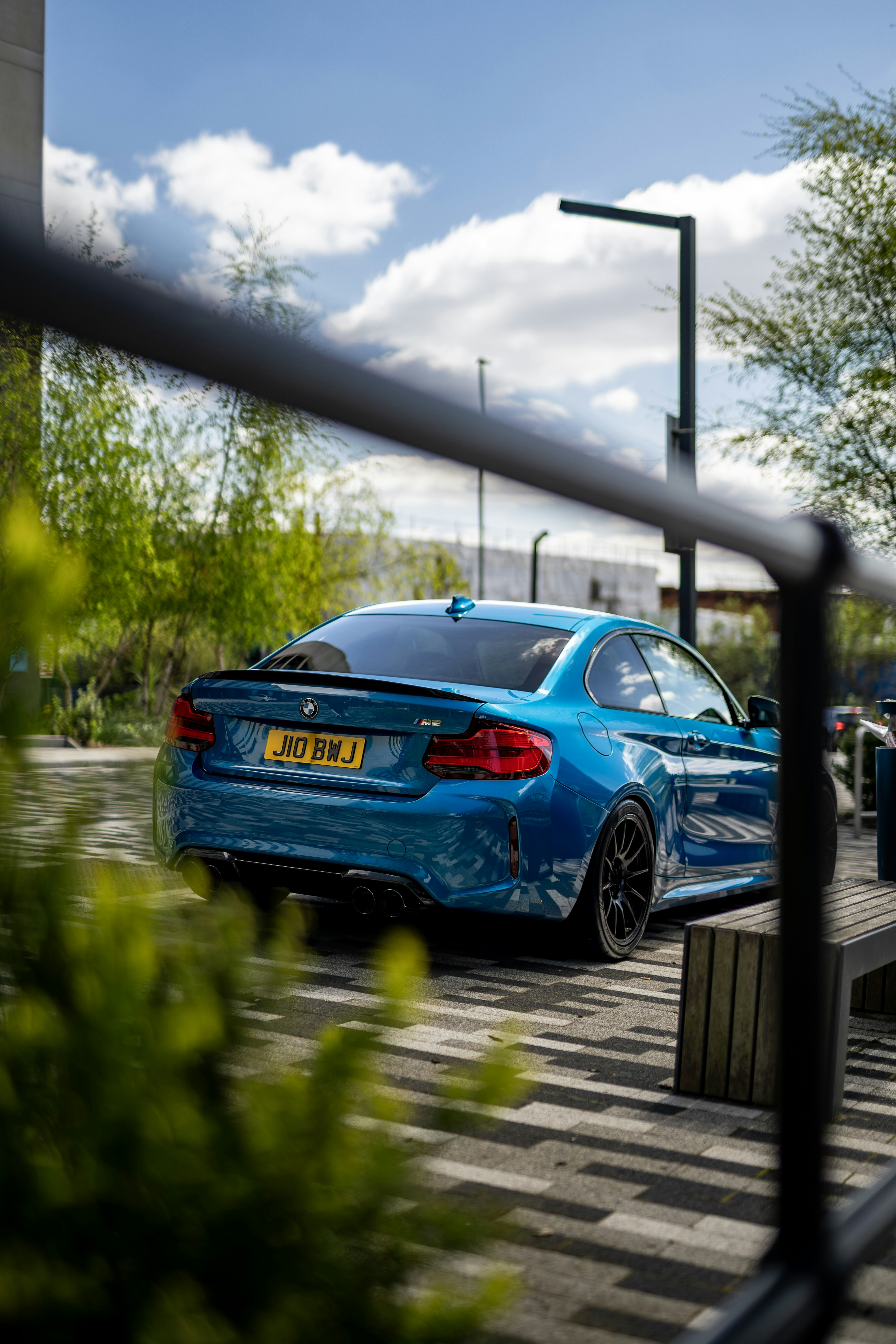 A blue car parked in front of a building