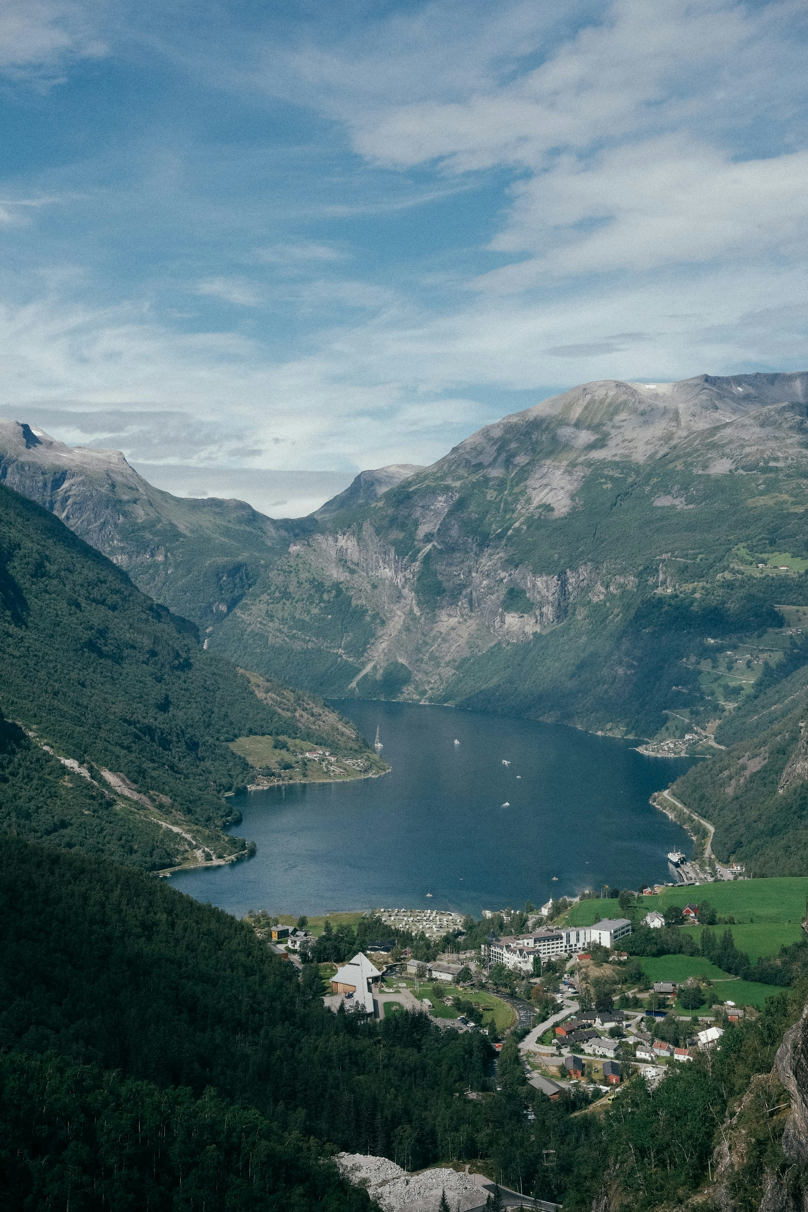 A scenic view of a lake surrounded by mountains
