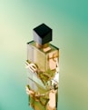 A bottle of perfume sitting on top of a table