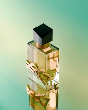 A bottle of perfume sitting on top of a table