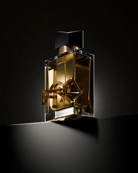 A bottle of perfume sitting on top of a table