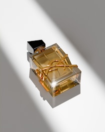 A bottle of perfume sitting on top of a table