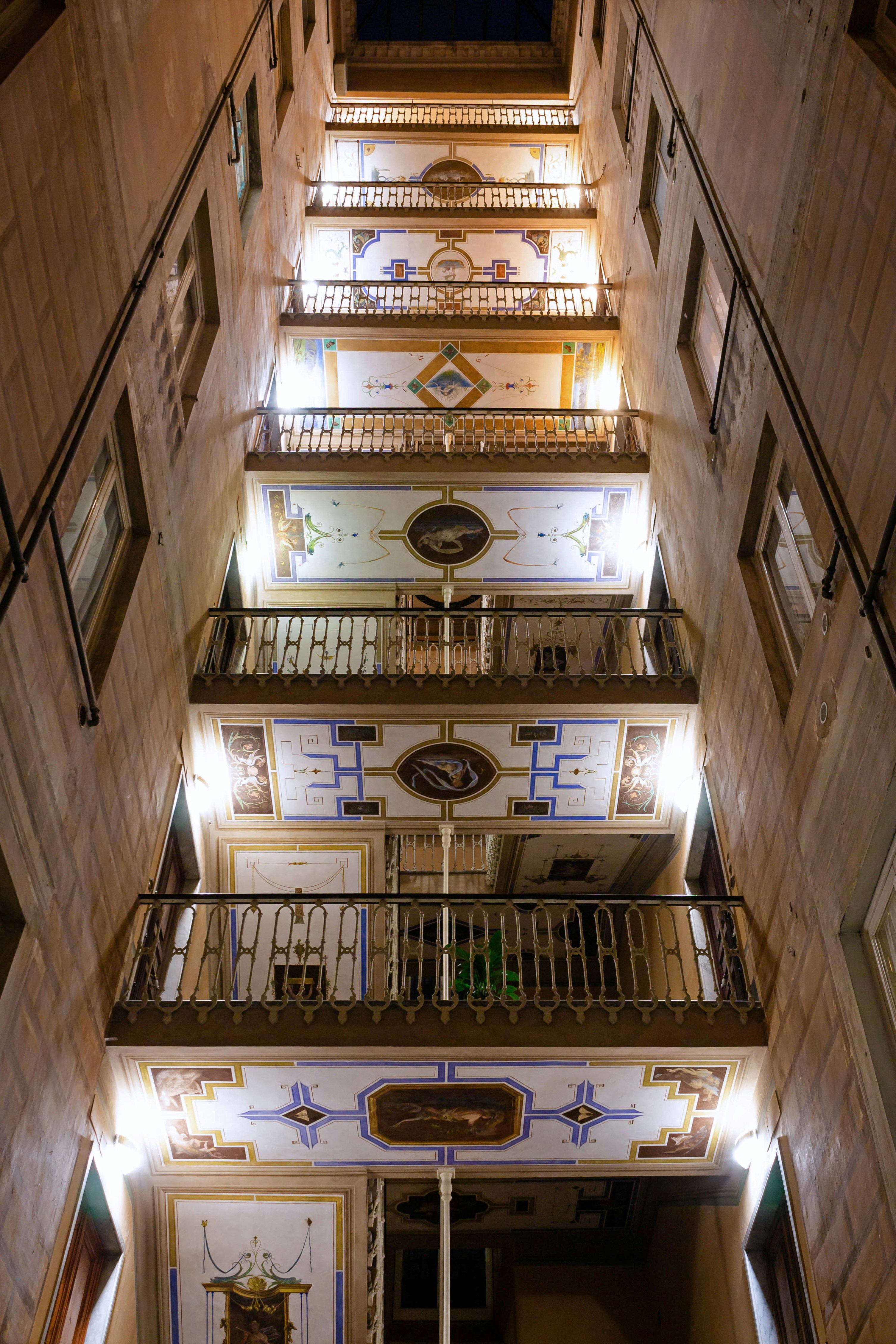 A very tall building with a bunch of balconies