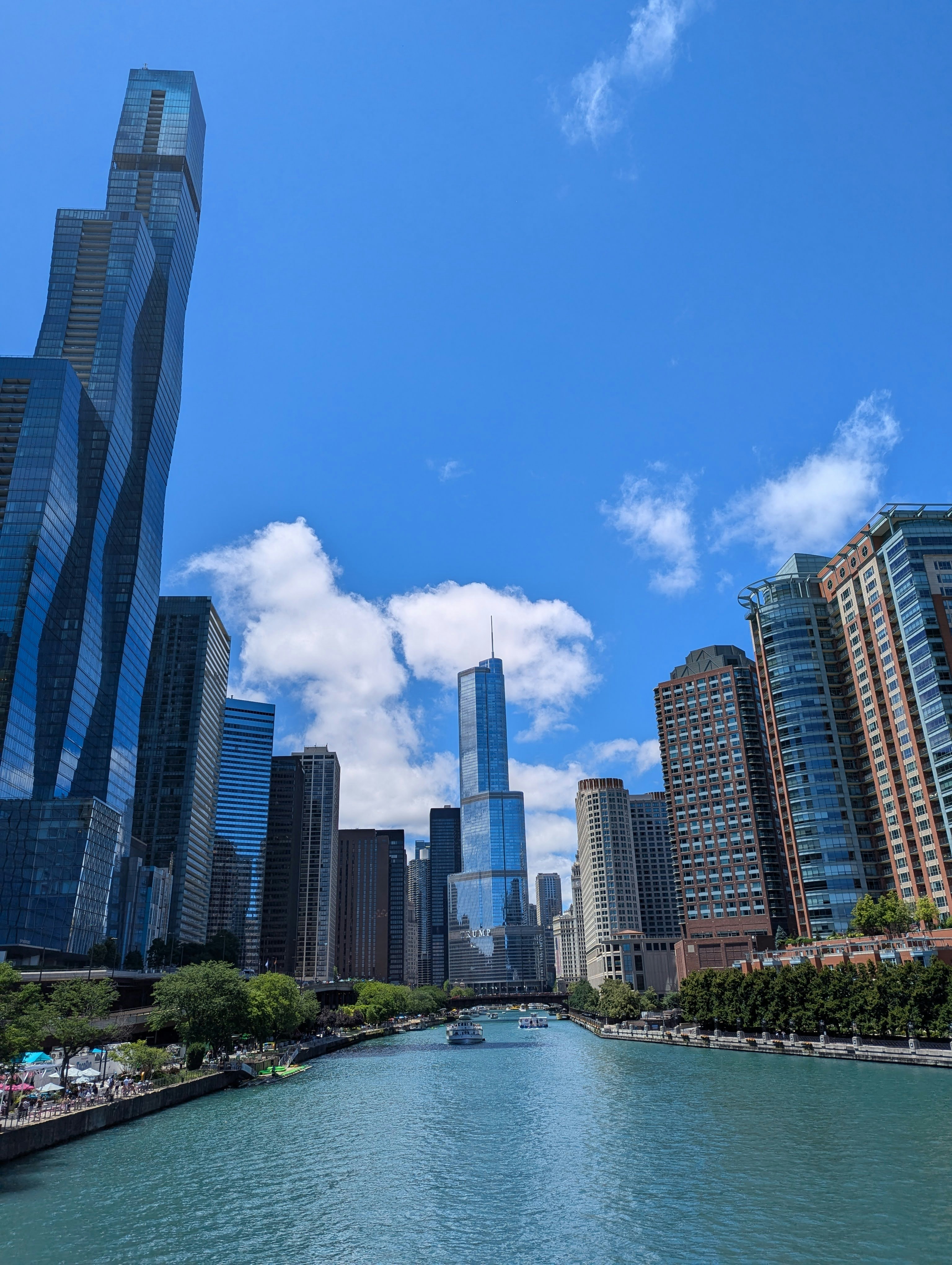 A river running through a city next to tall buildings