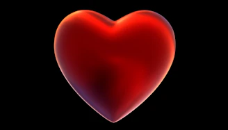 A red heart on a black background