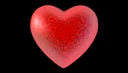A red heart on a black background