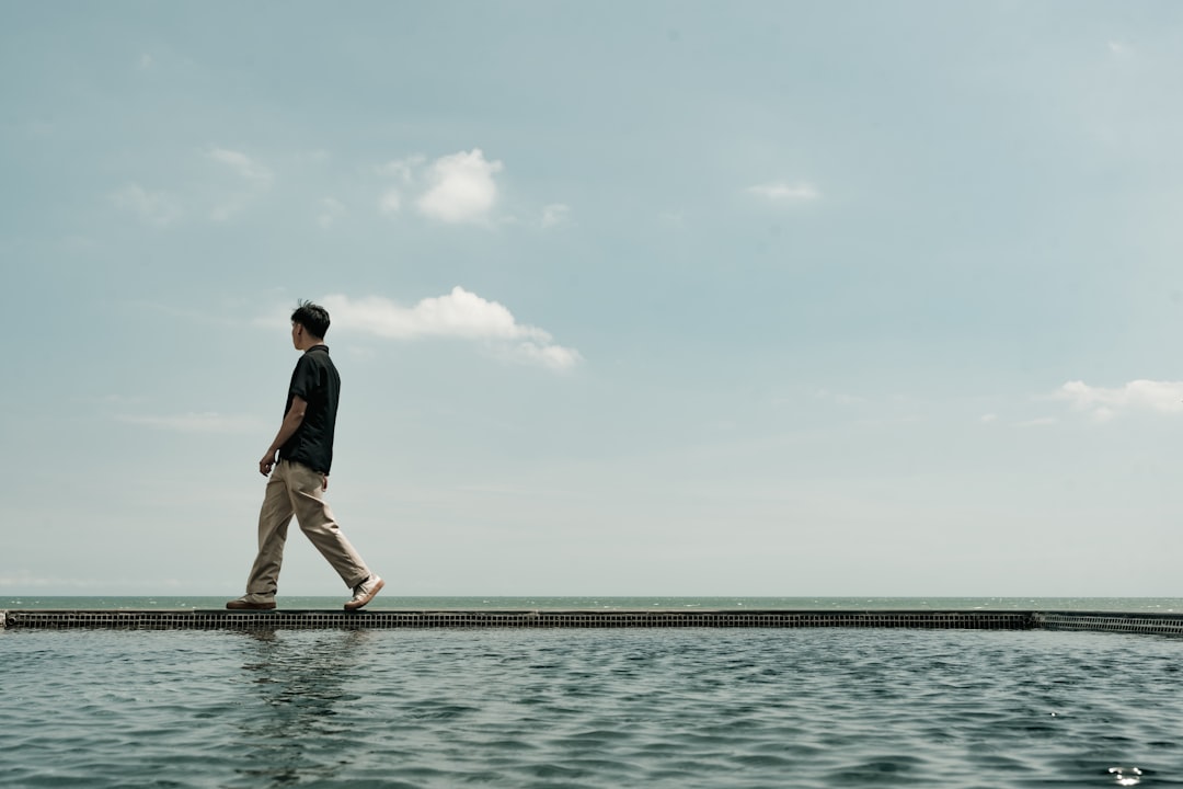 A man walking across a large body of water